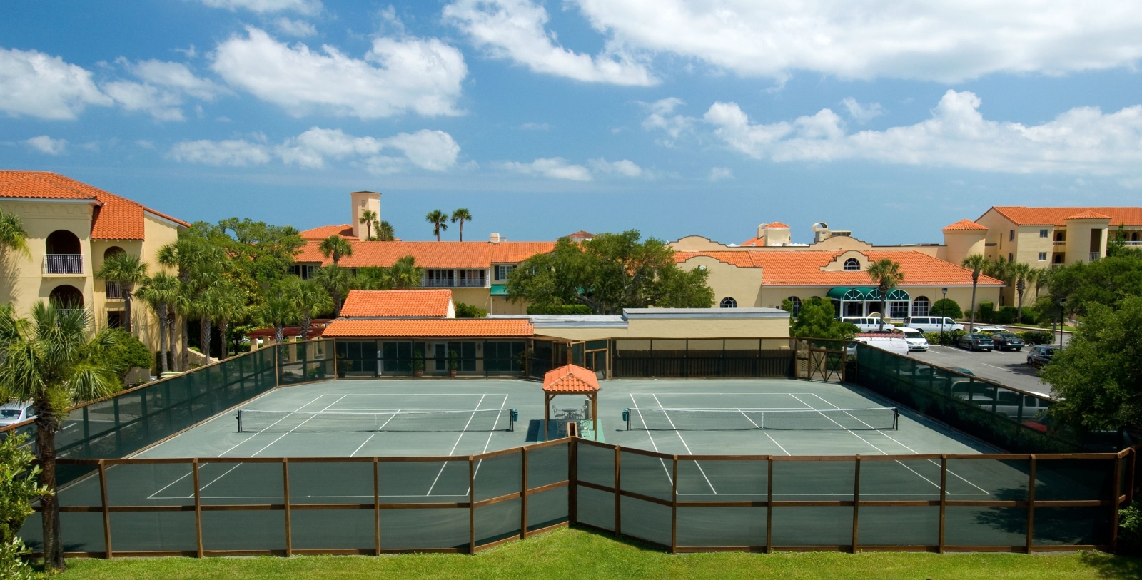 a tennis court with a fence around it