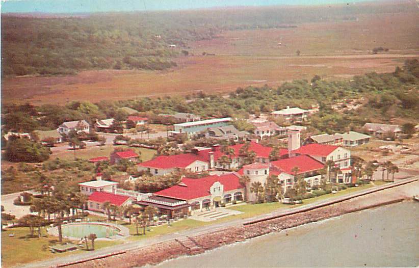a large group of houses by a body of water
