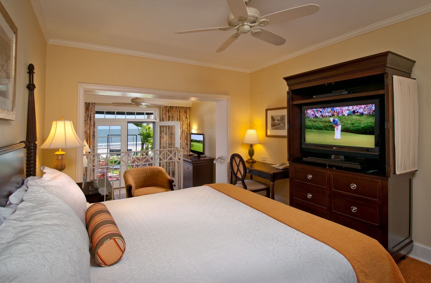 a bedroom with a television and a large bed