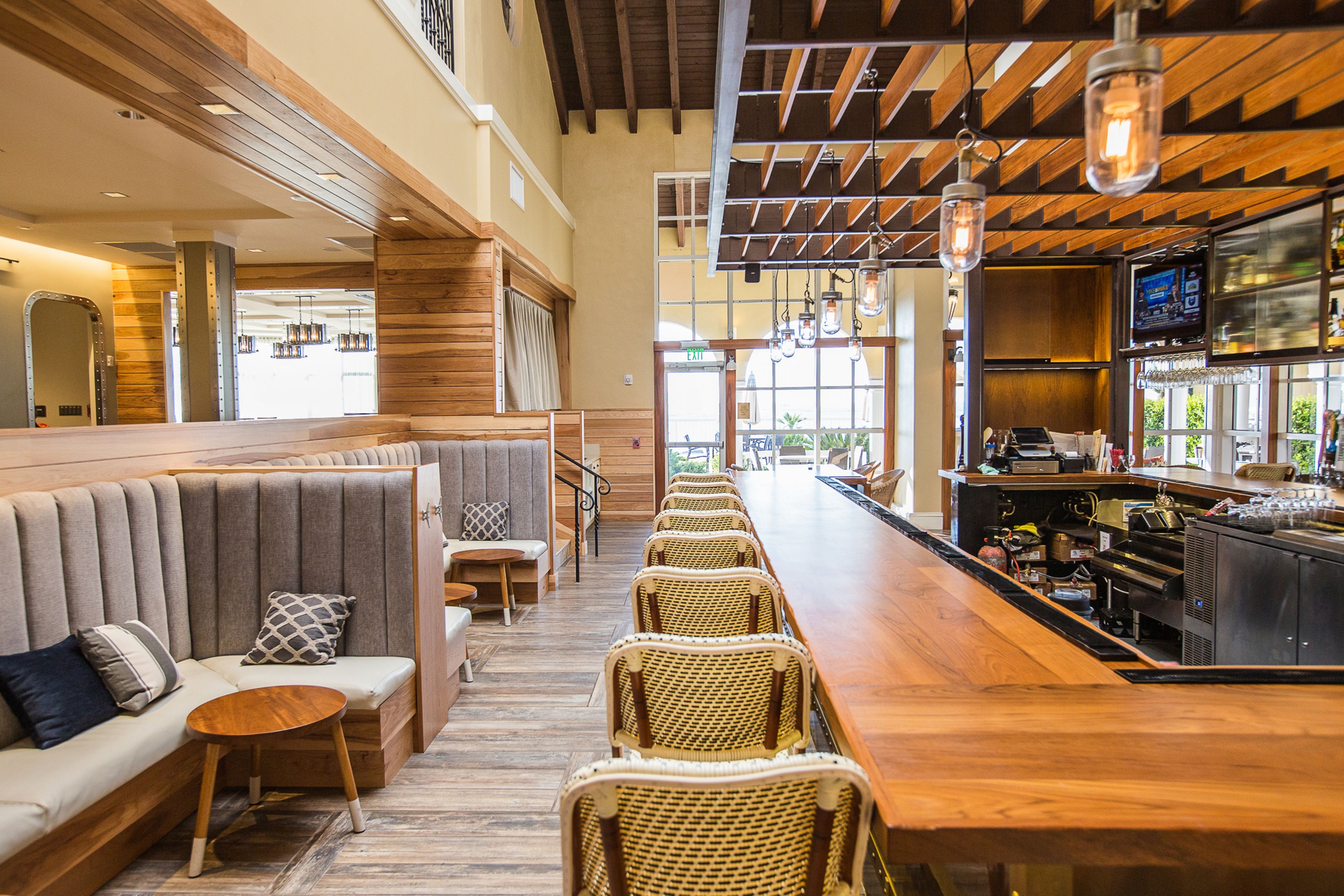 a restaurant with a long table and chairs