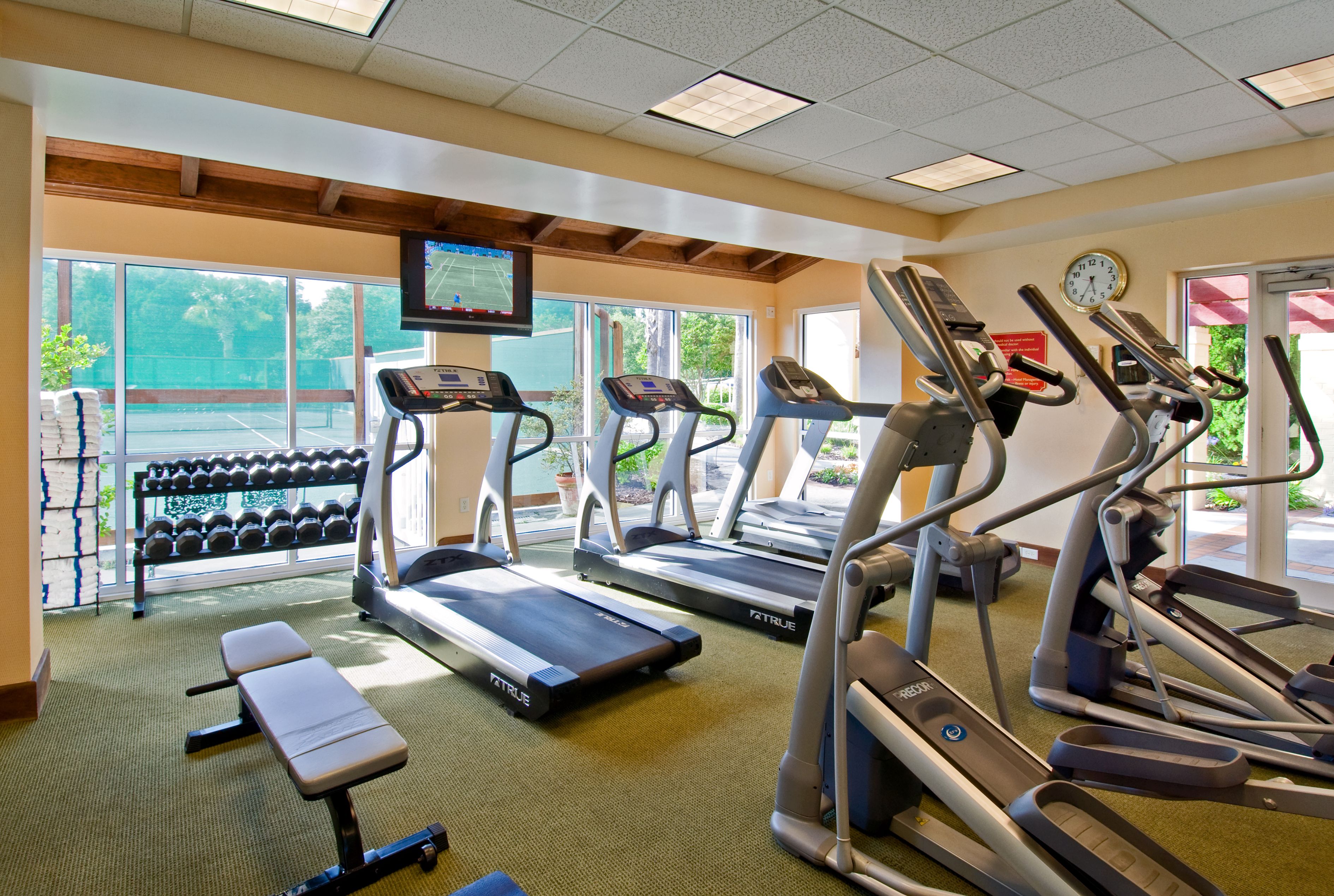 a room with treadmills and exercise equipment