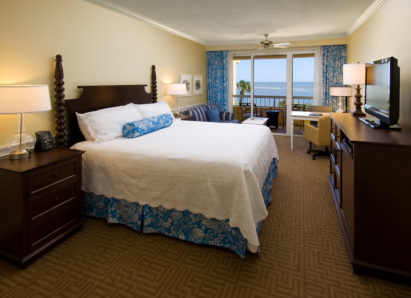 a bedroom with a large bed and a dresser