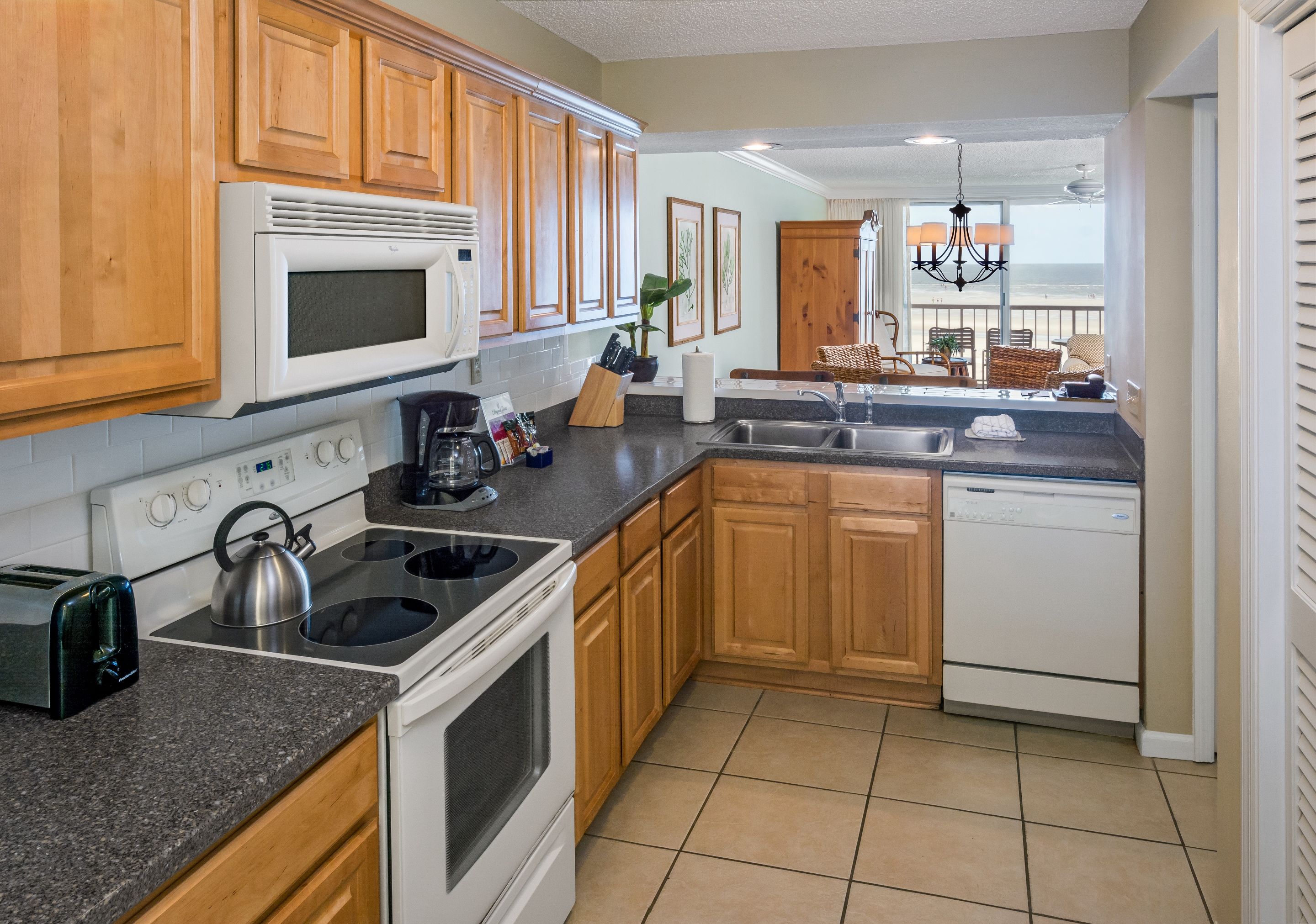 a kitchen with a stove and microwave