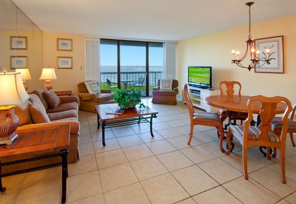 a living room with a television and a table