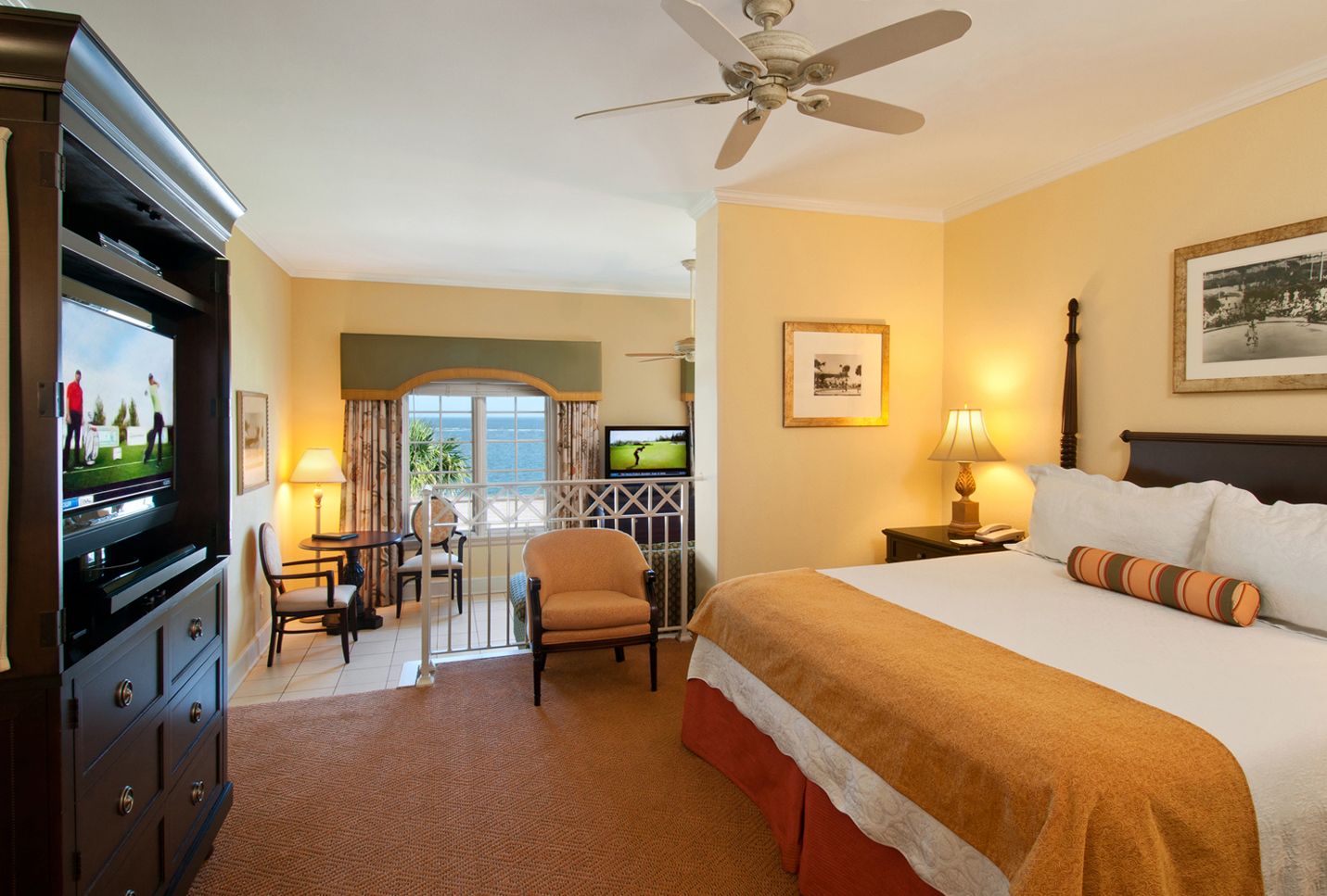 a room with a bed and a television