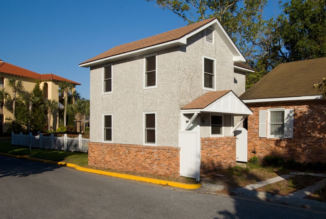 a house with a white fence
