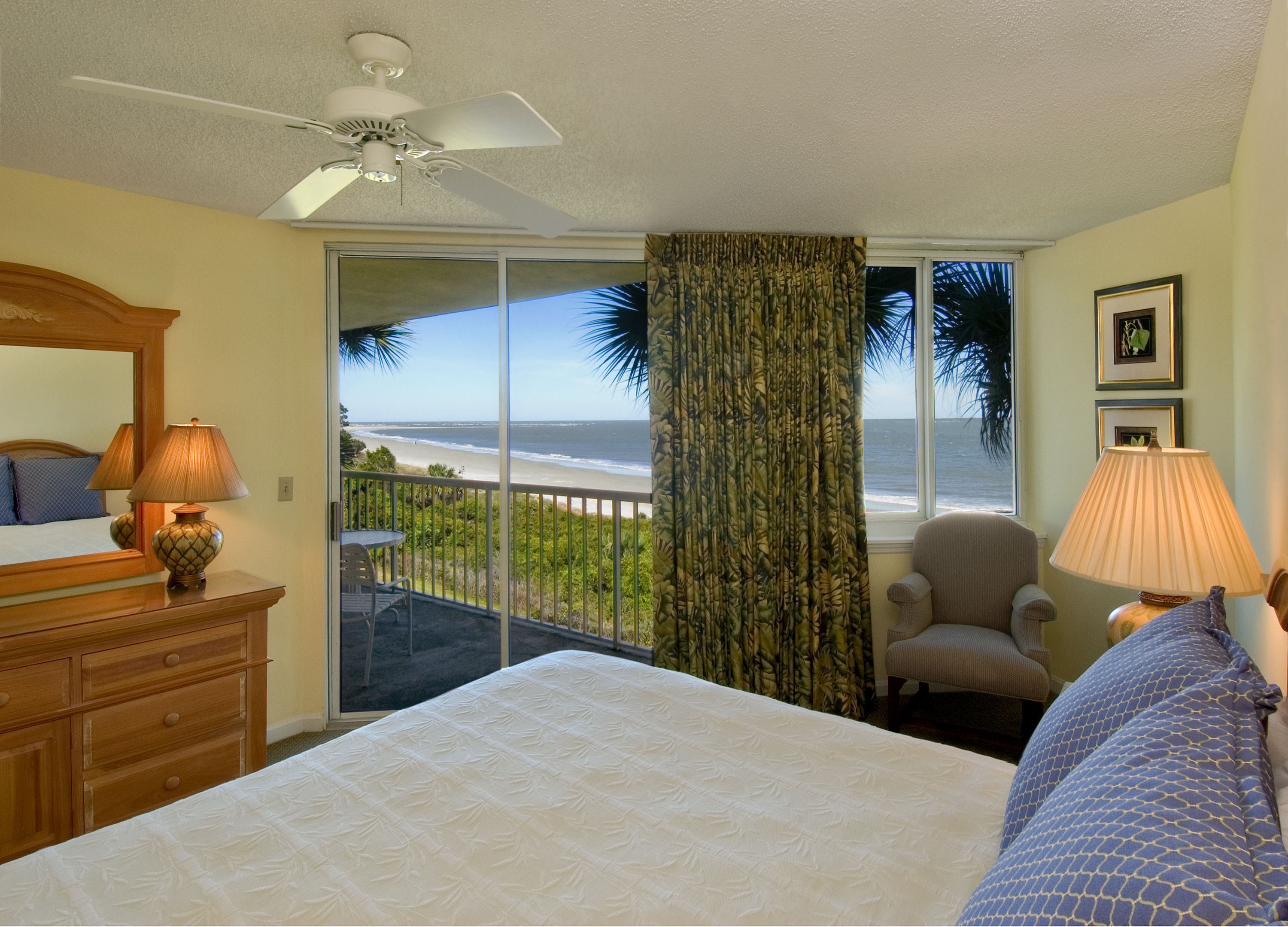 a bedroom with a large glass door