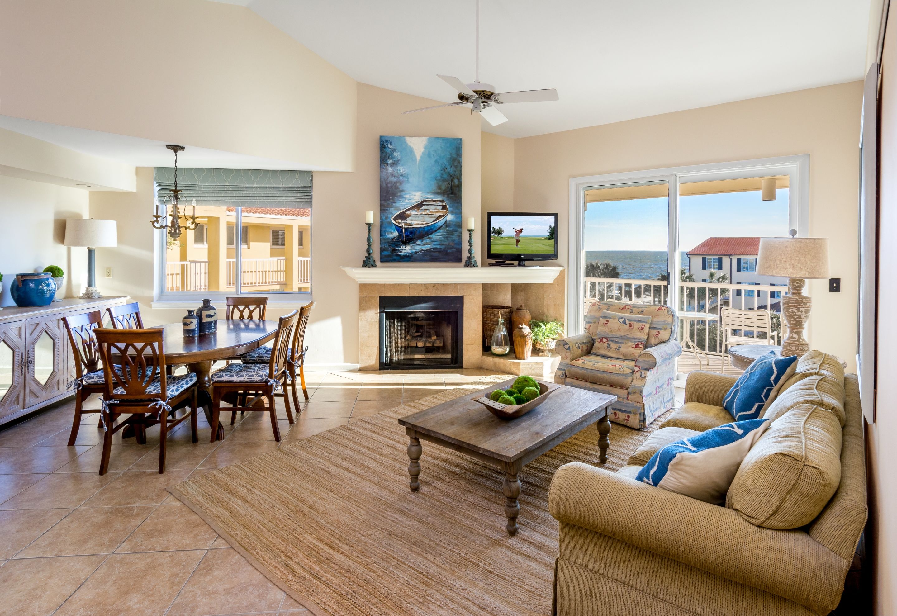 a living room with a fireplace and a television