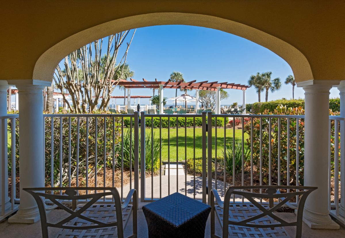 a view of a patio from a balcony