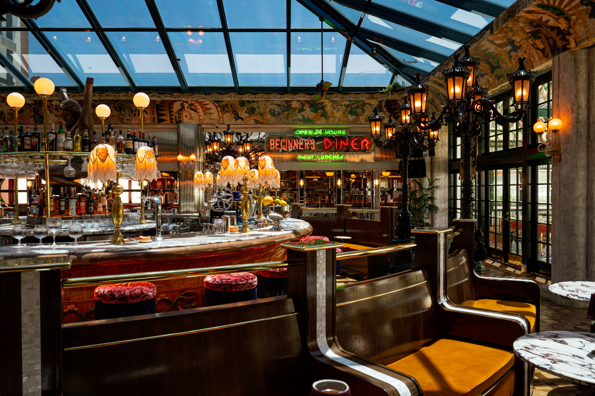 a restaurant with a bar and a glass roof