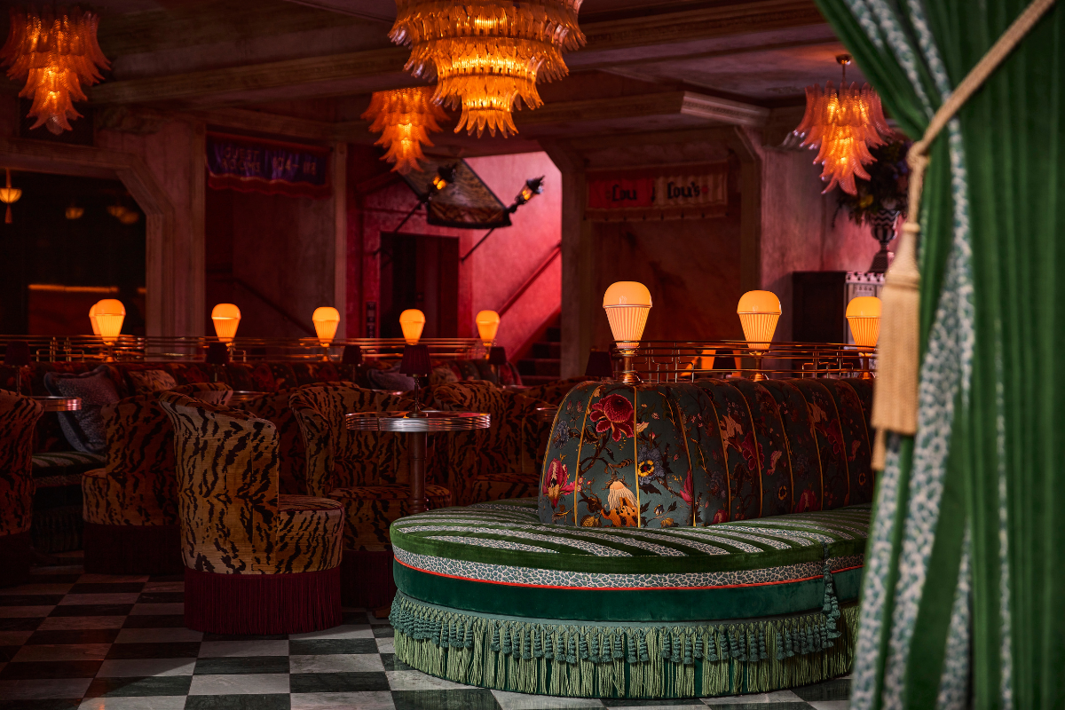 a room with a couch and chandeliers