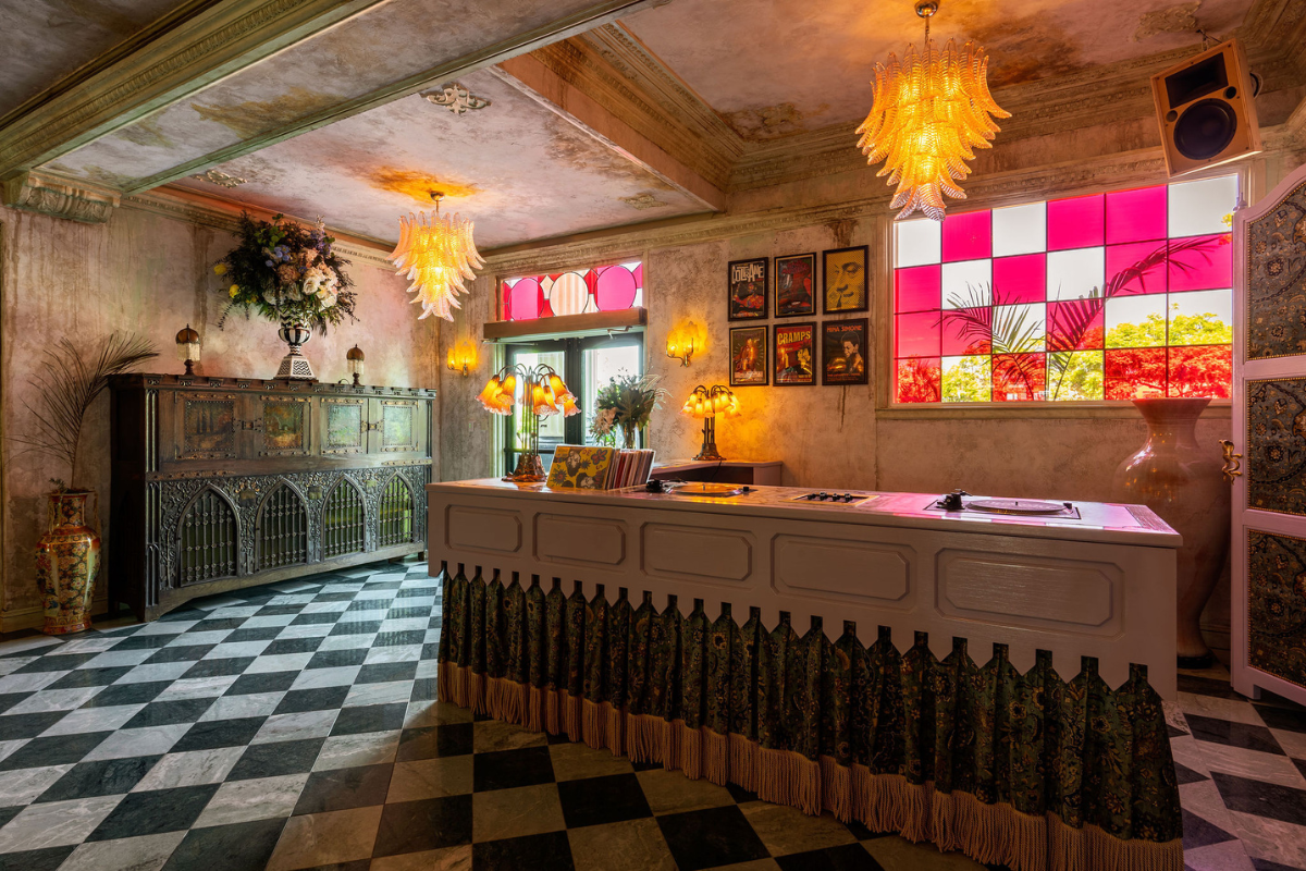 a room with a counter and a checkered floor