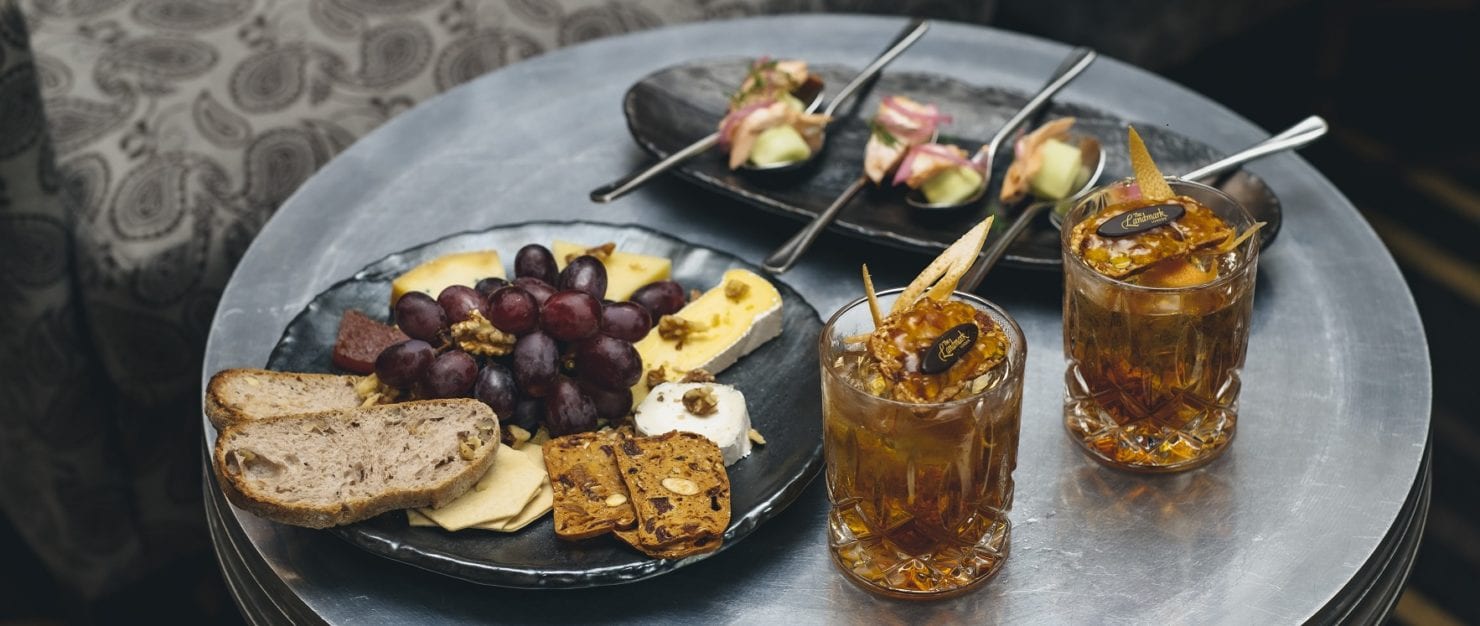 a plate of food and a drink on a table