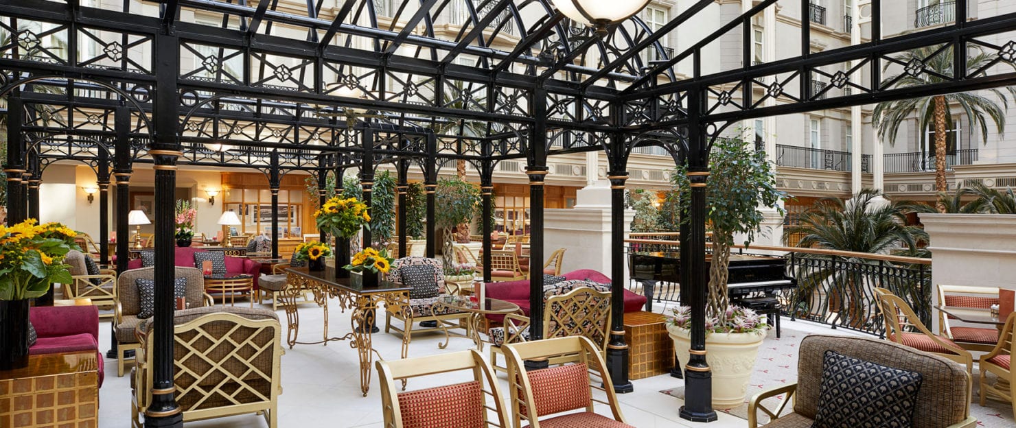 a patio area with chairs and tables