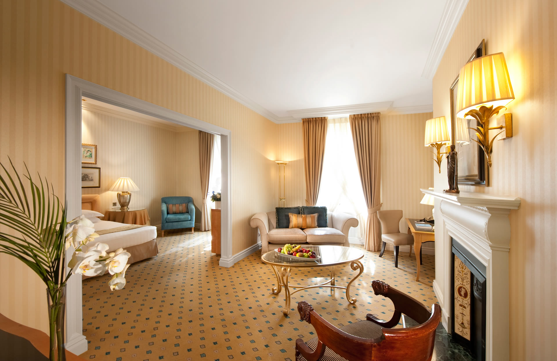 a room with a fireplace and two beds