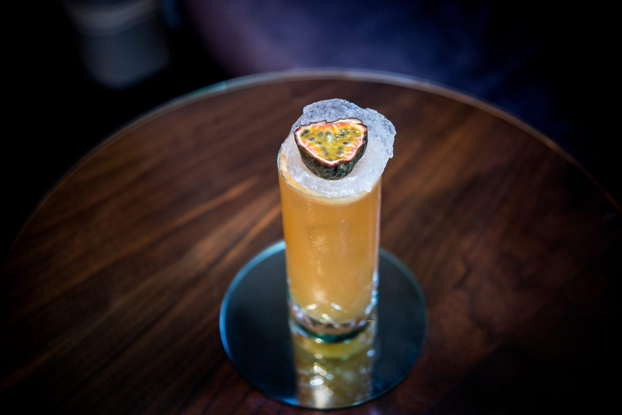 a glass with a drink on top of it