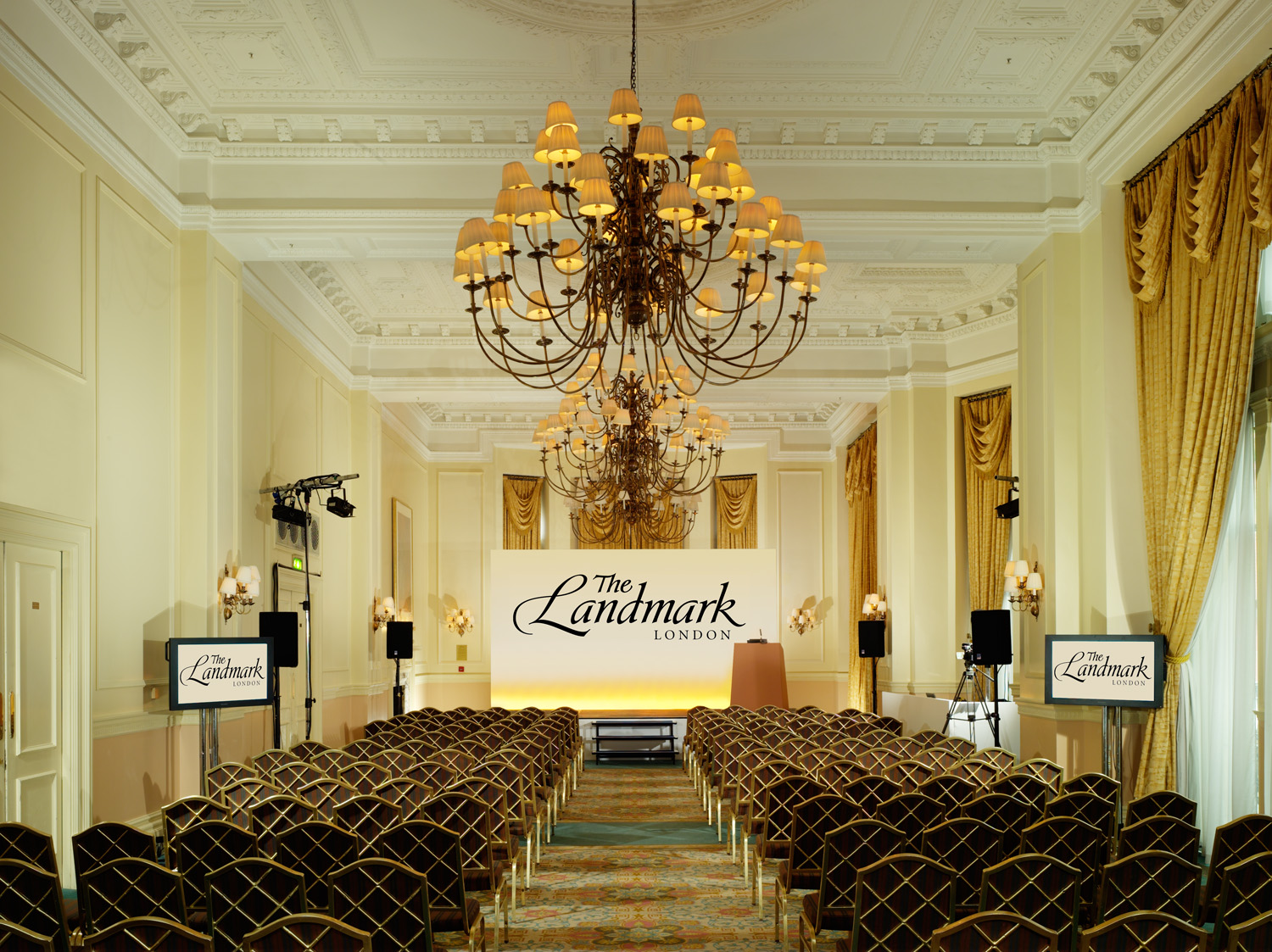 a chandelier in a room with chairs