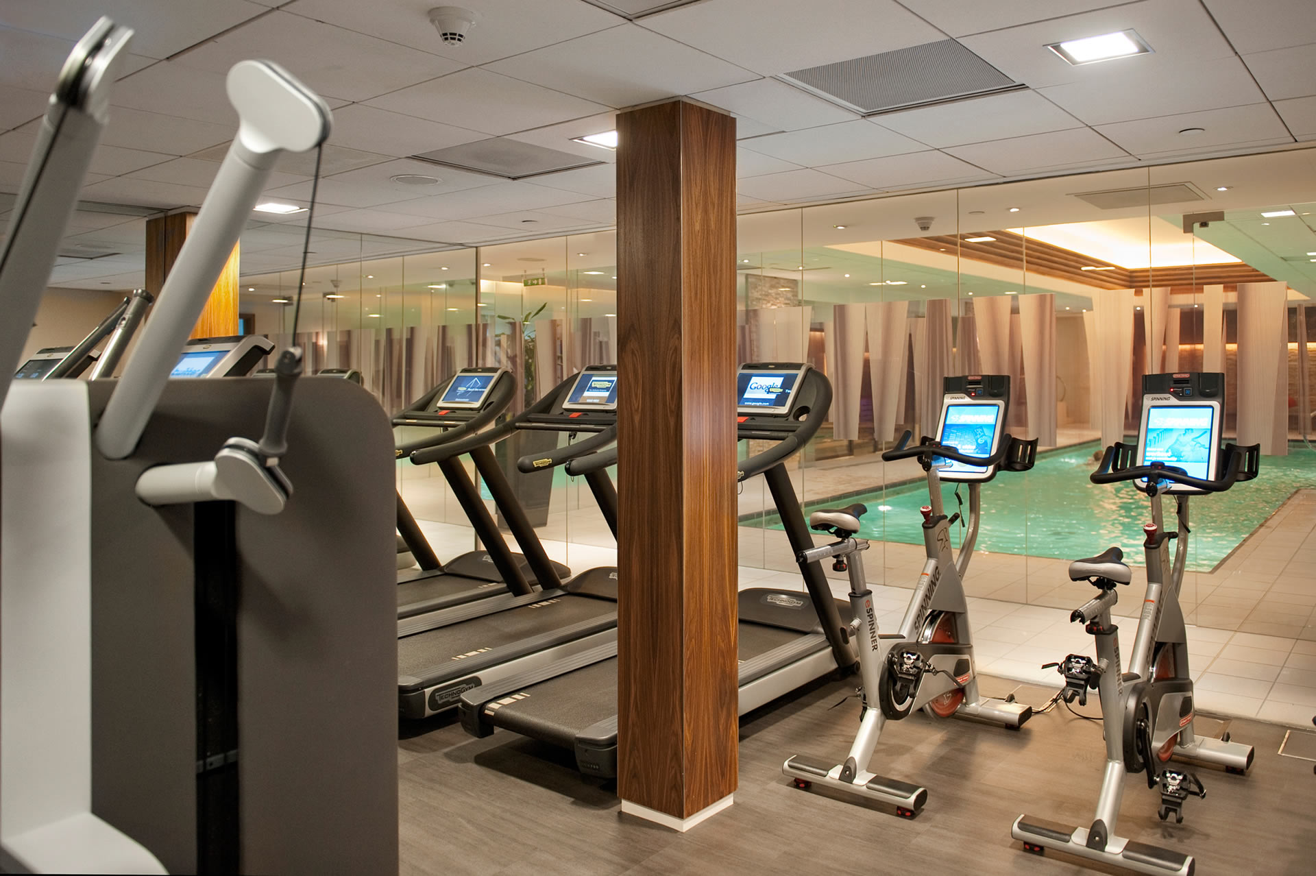 a room with treadmills and exercise bikes