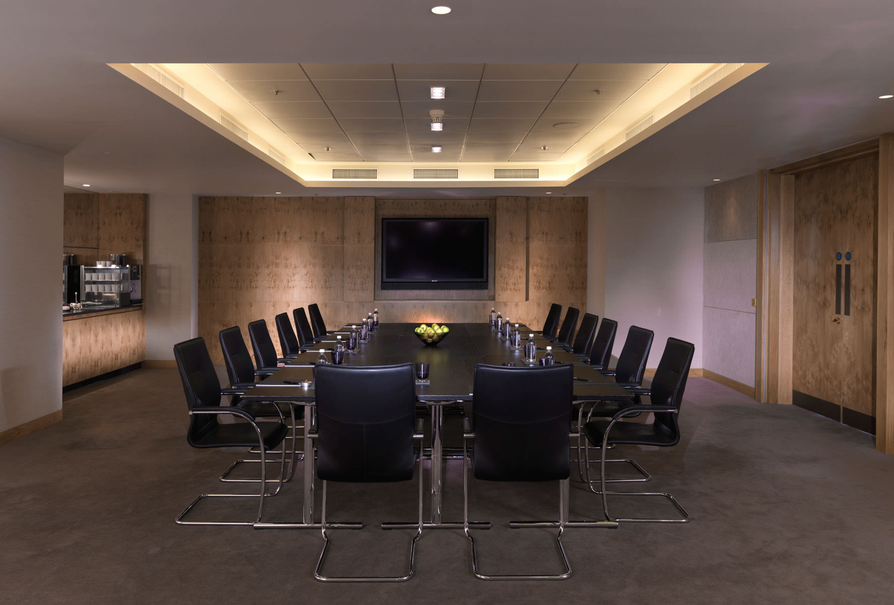 a conference room with a table and chairs