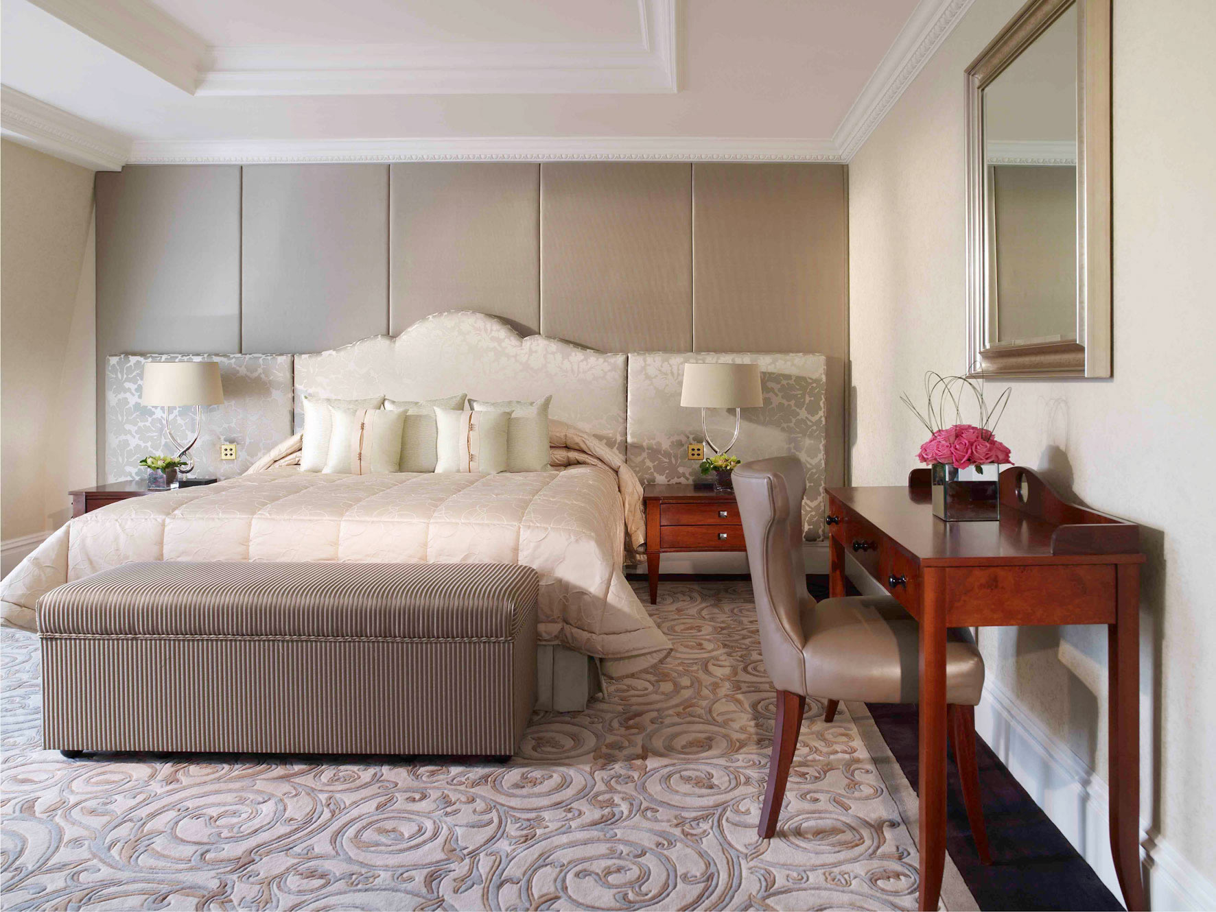 a bedroom with a bed and a desk