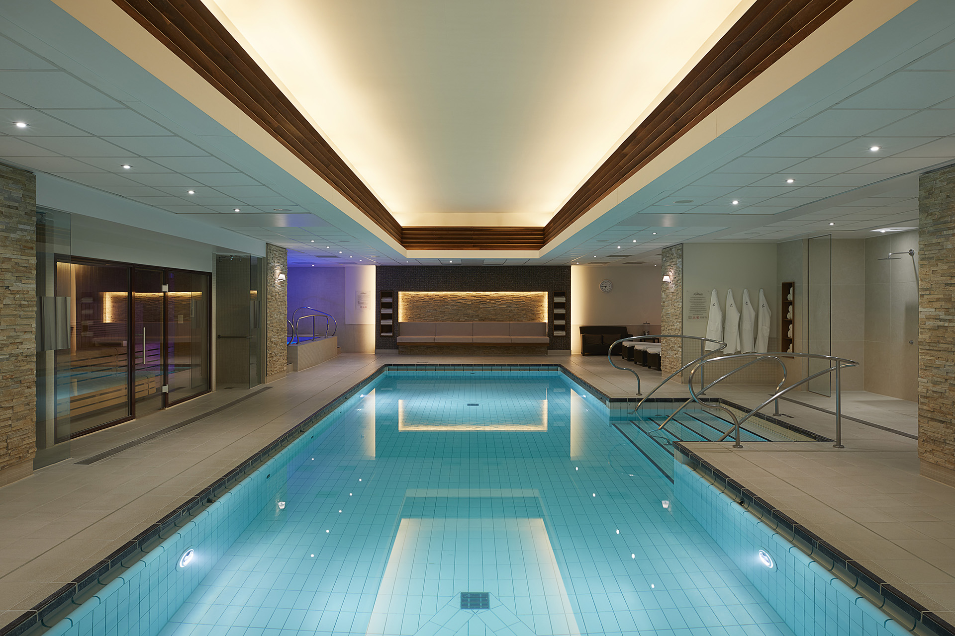 a indoor swimming pool with a staircase