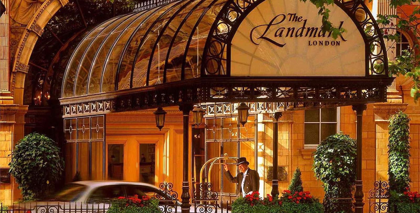 a man standing outside a hotel