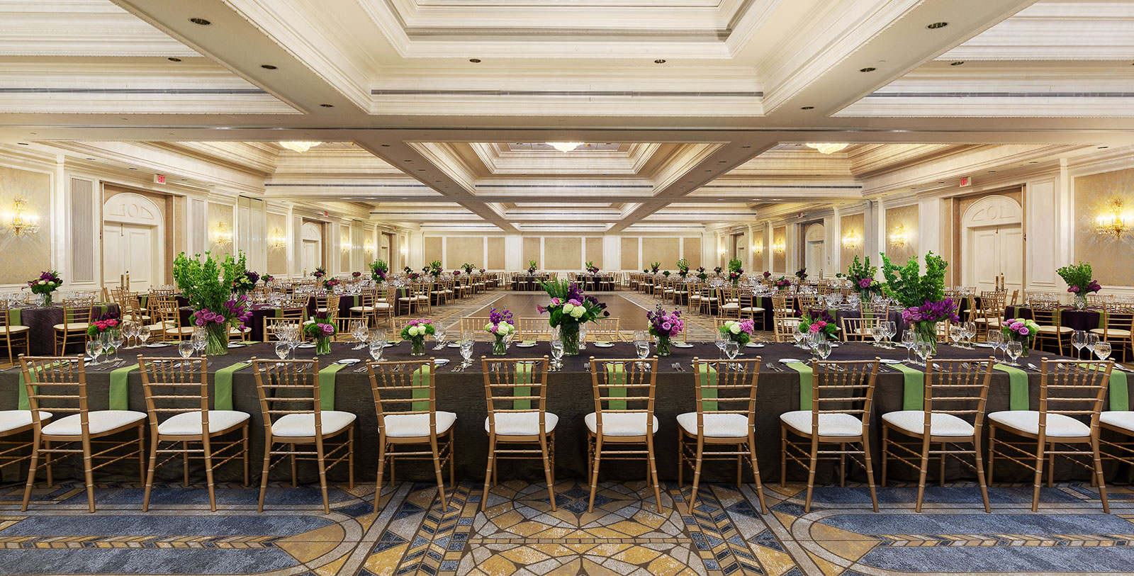 a large ballroom with tables and chairs