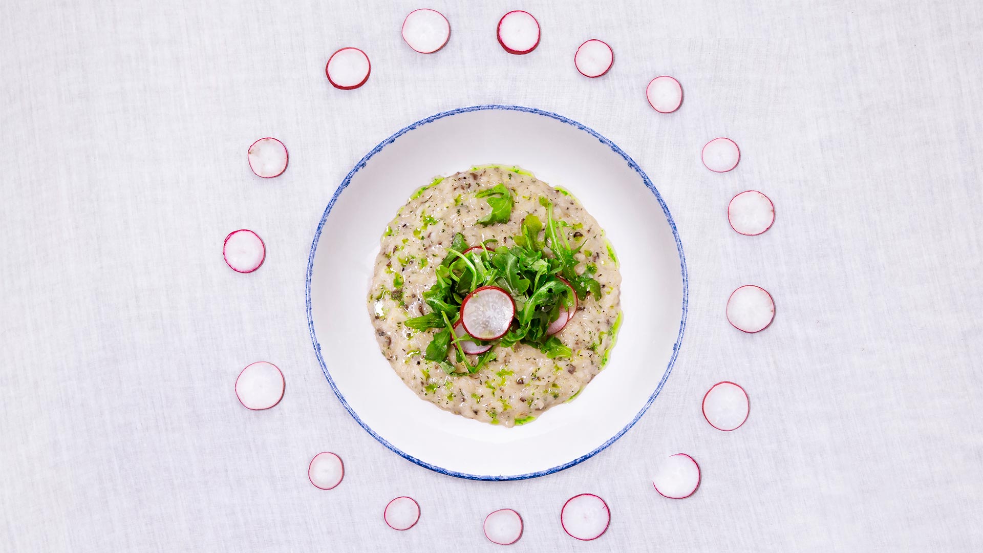 a plate of food with radishes around it