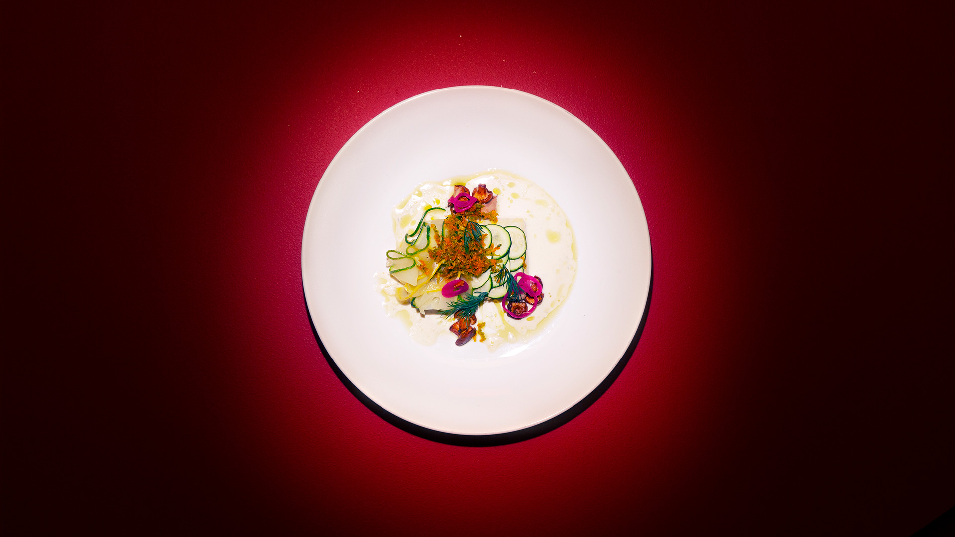 a plate of food on a red surface