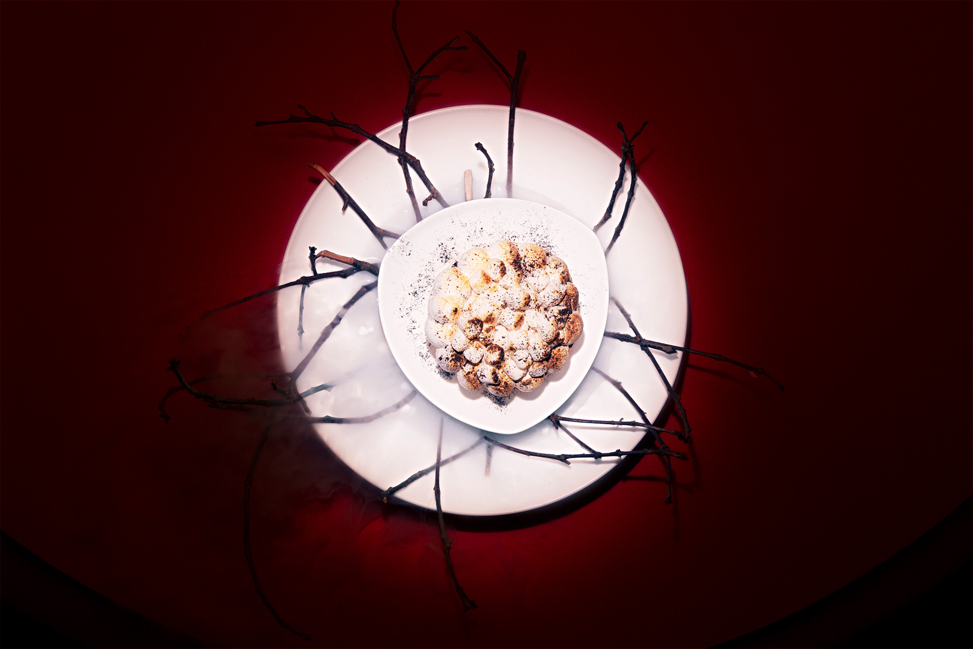 a plate with a bowl of popcorn and sticks on it