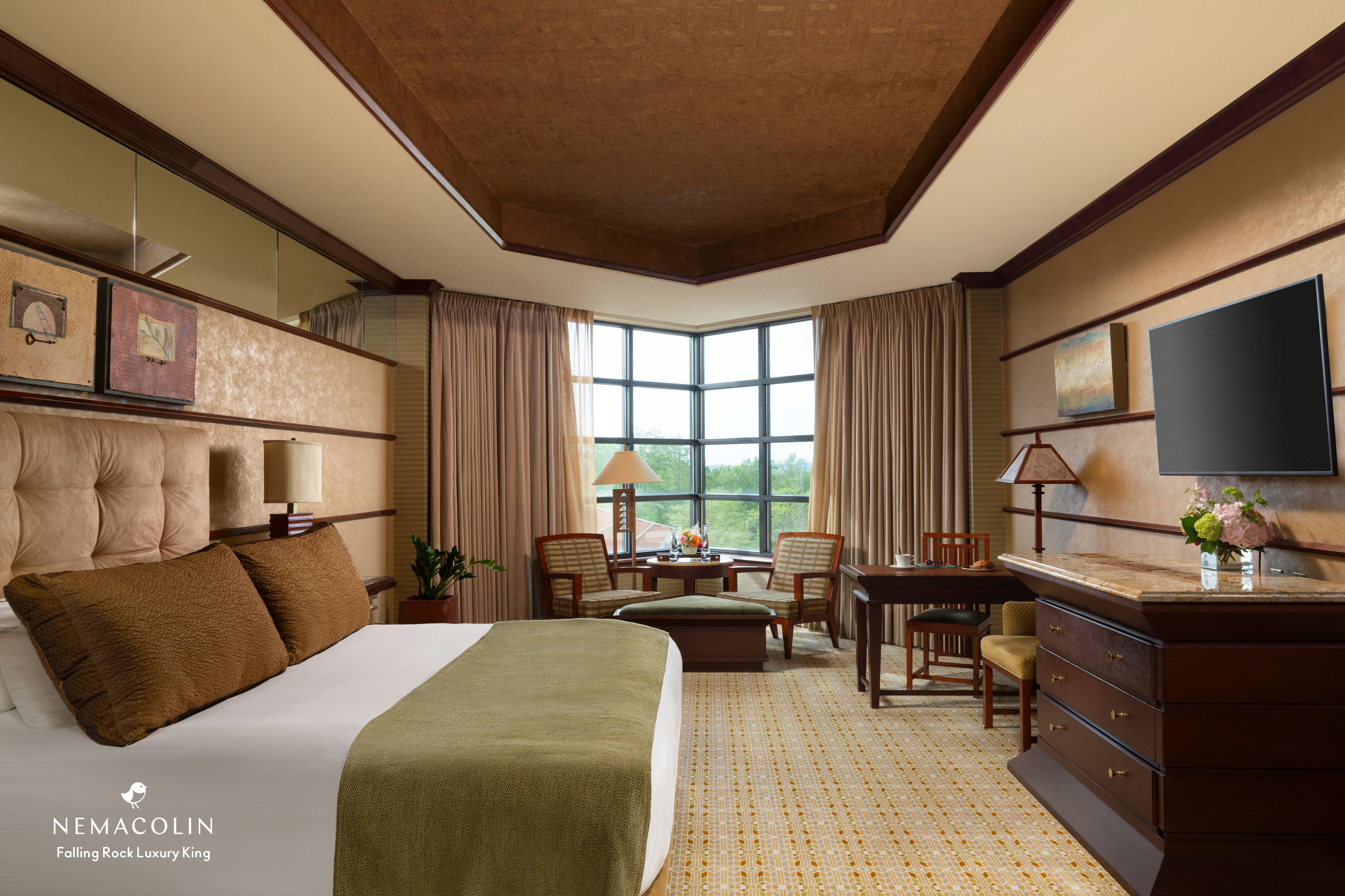 a room with a bed and a desk and chair