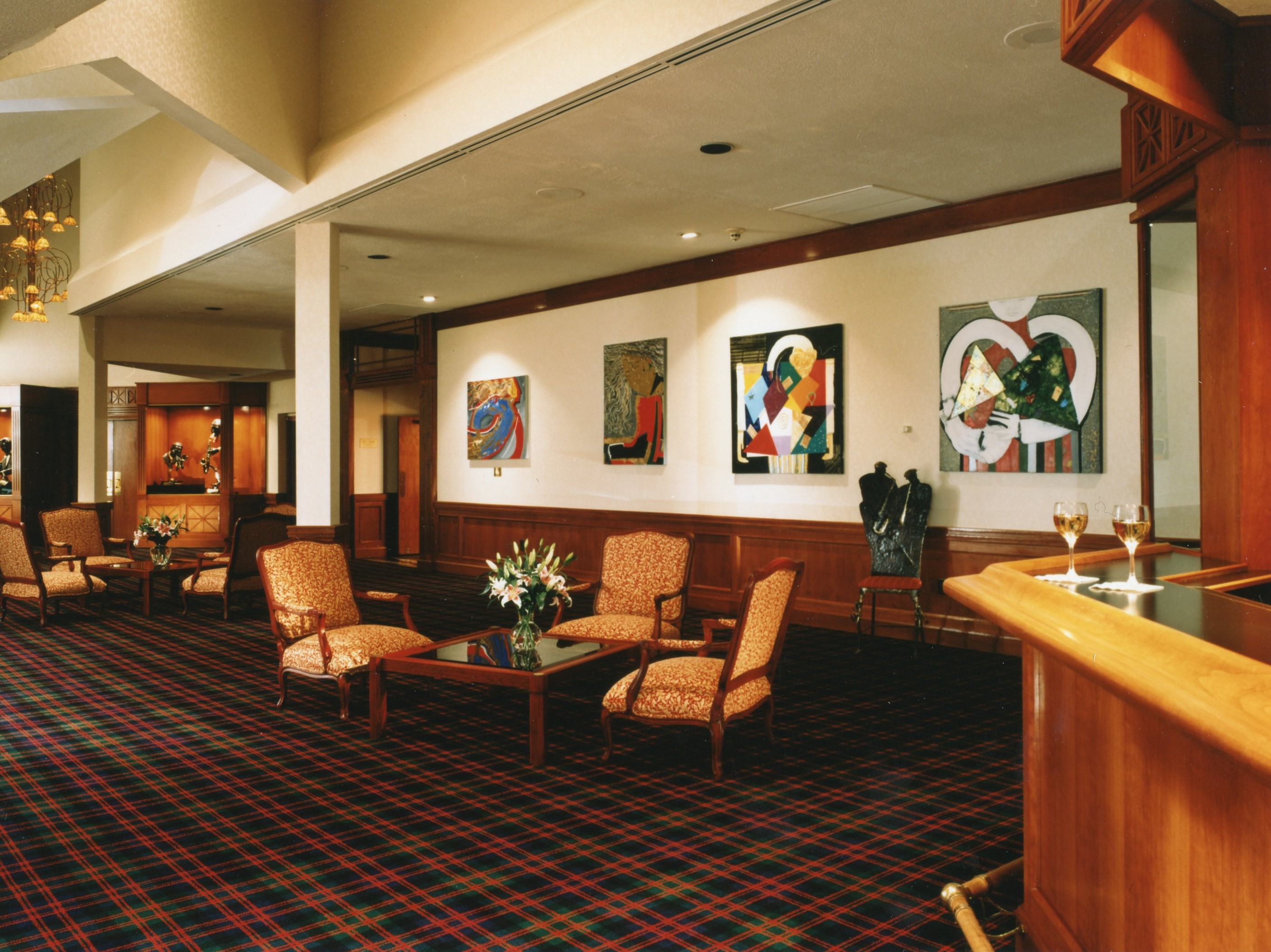 a room with a checkered floor and chairs