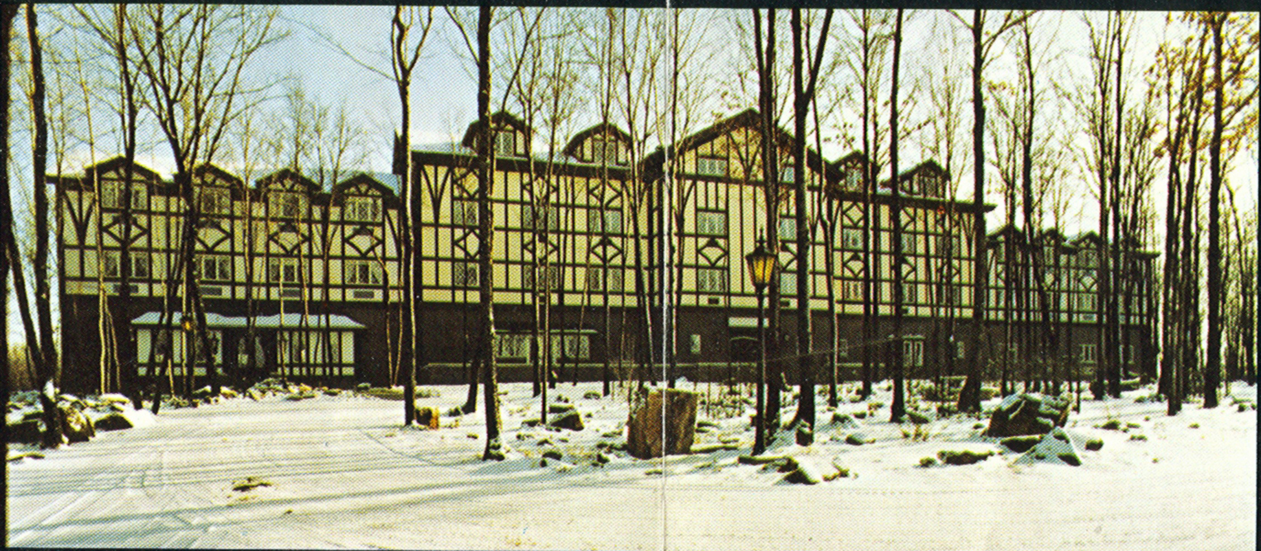 a building with trees in the snow