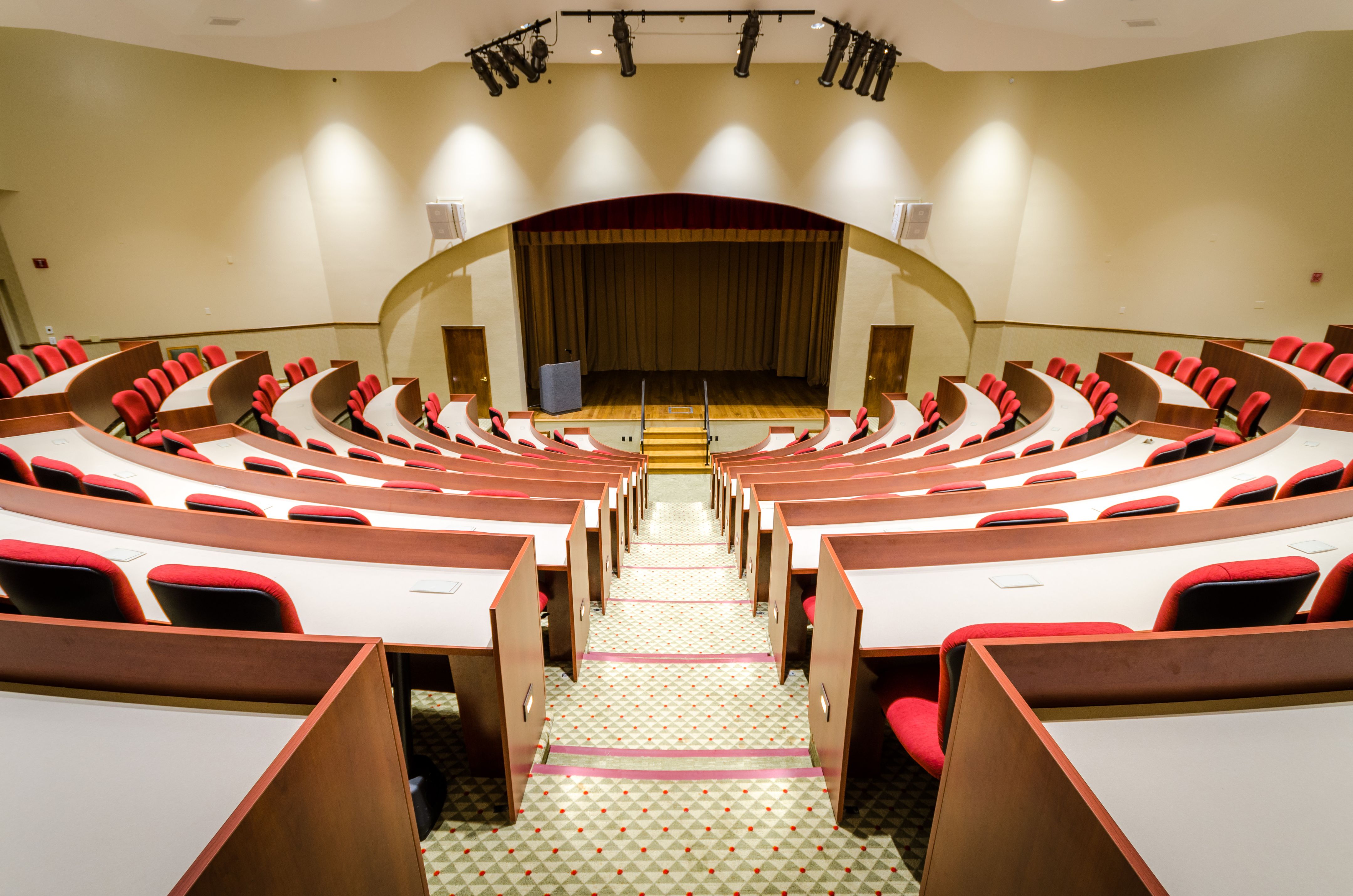 a room with chairs and a stage