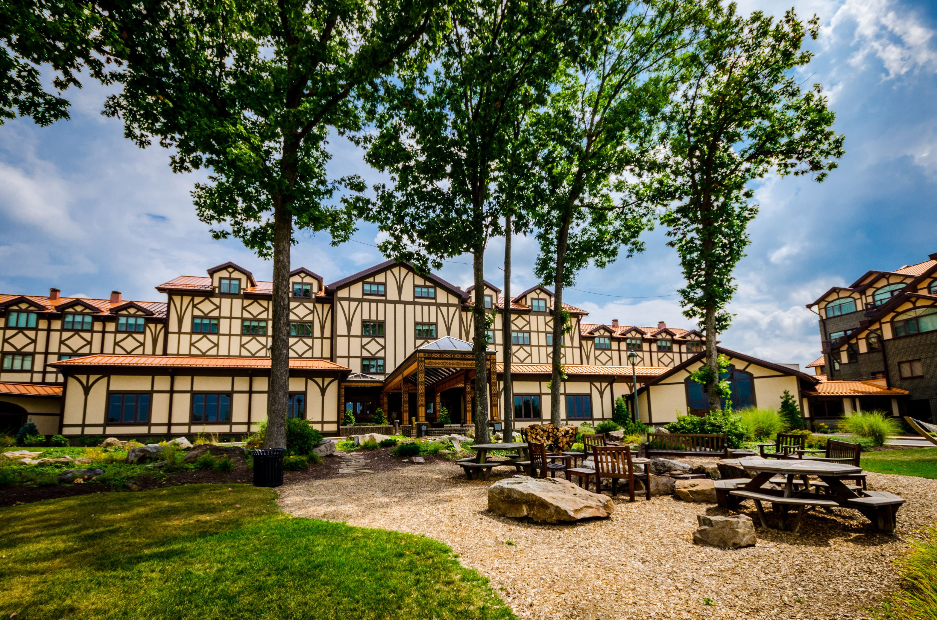 a building with trees and a patio