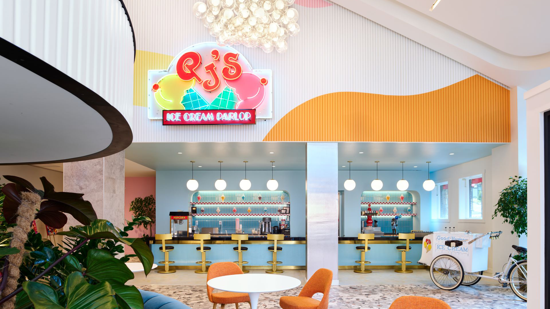 a room with a large sign and a bar