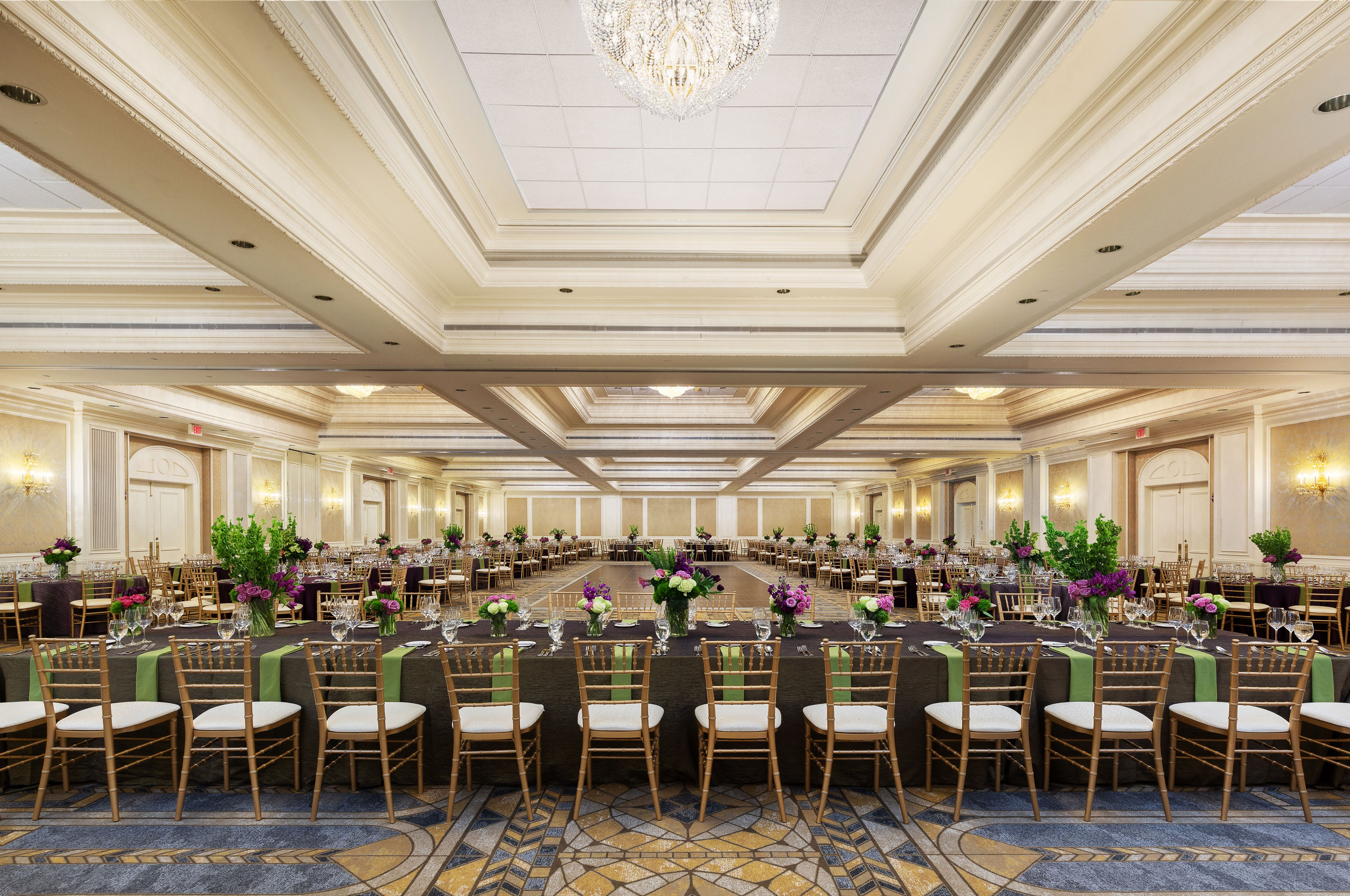 a large ballroom with tables and chairs
