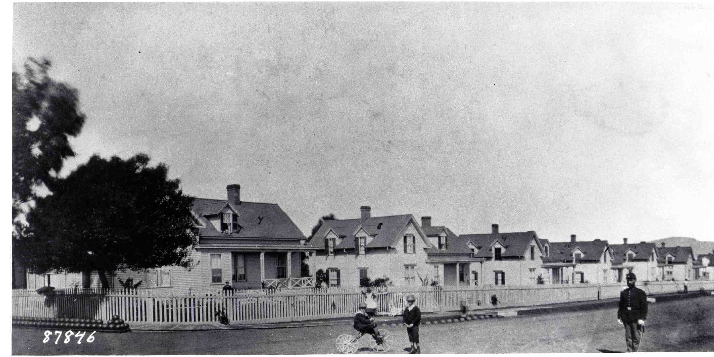 a couple of people in front of a house
