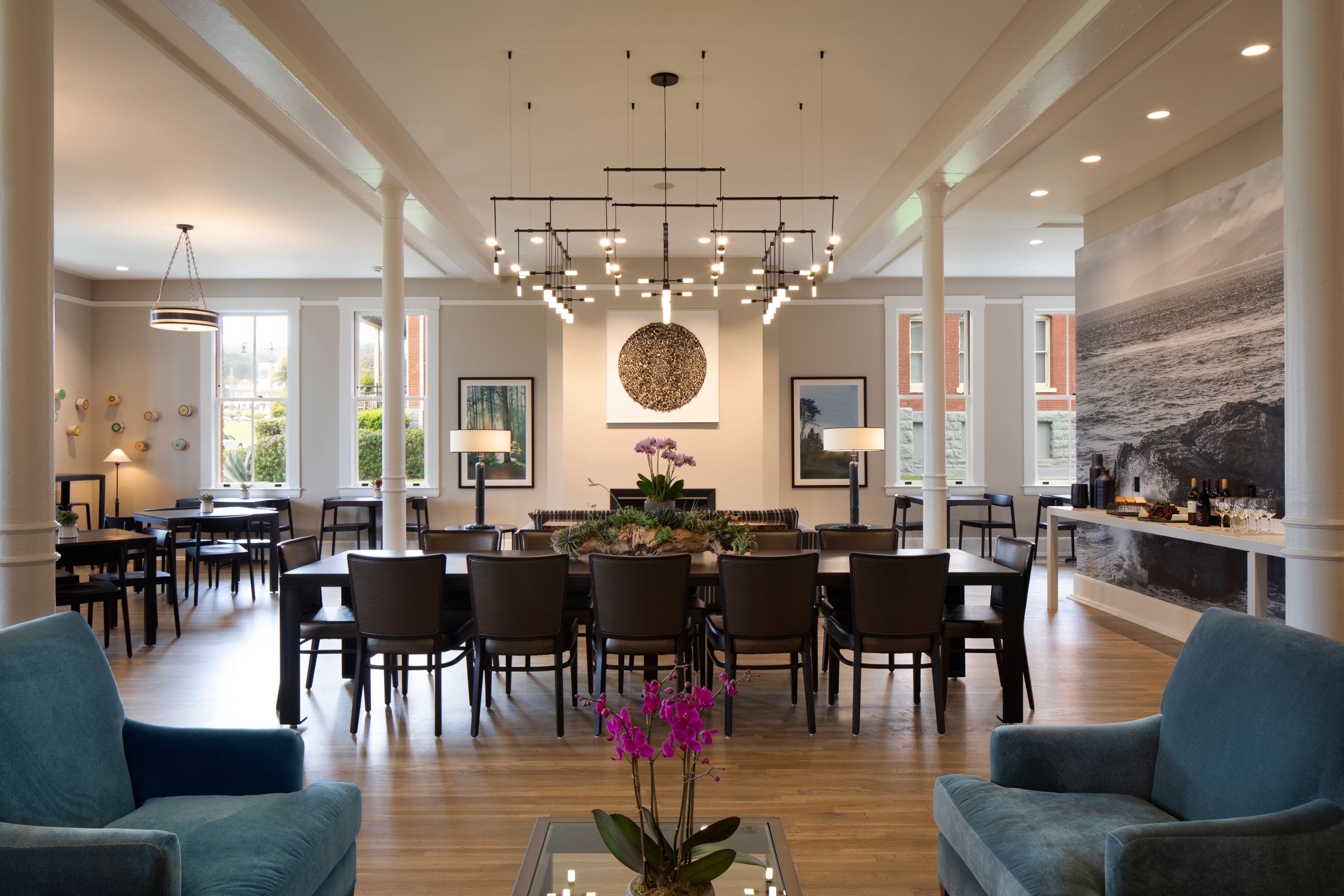 a room with a large table and chairs
