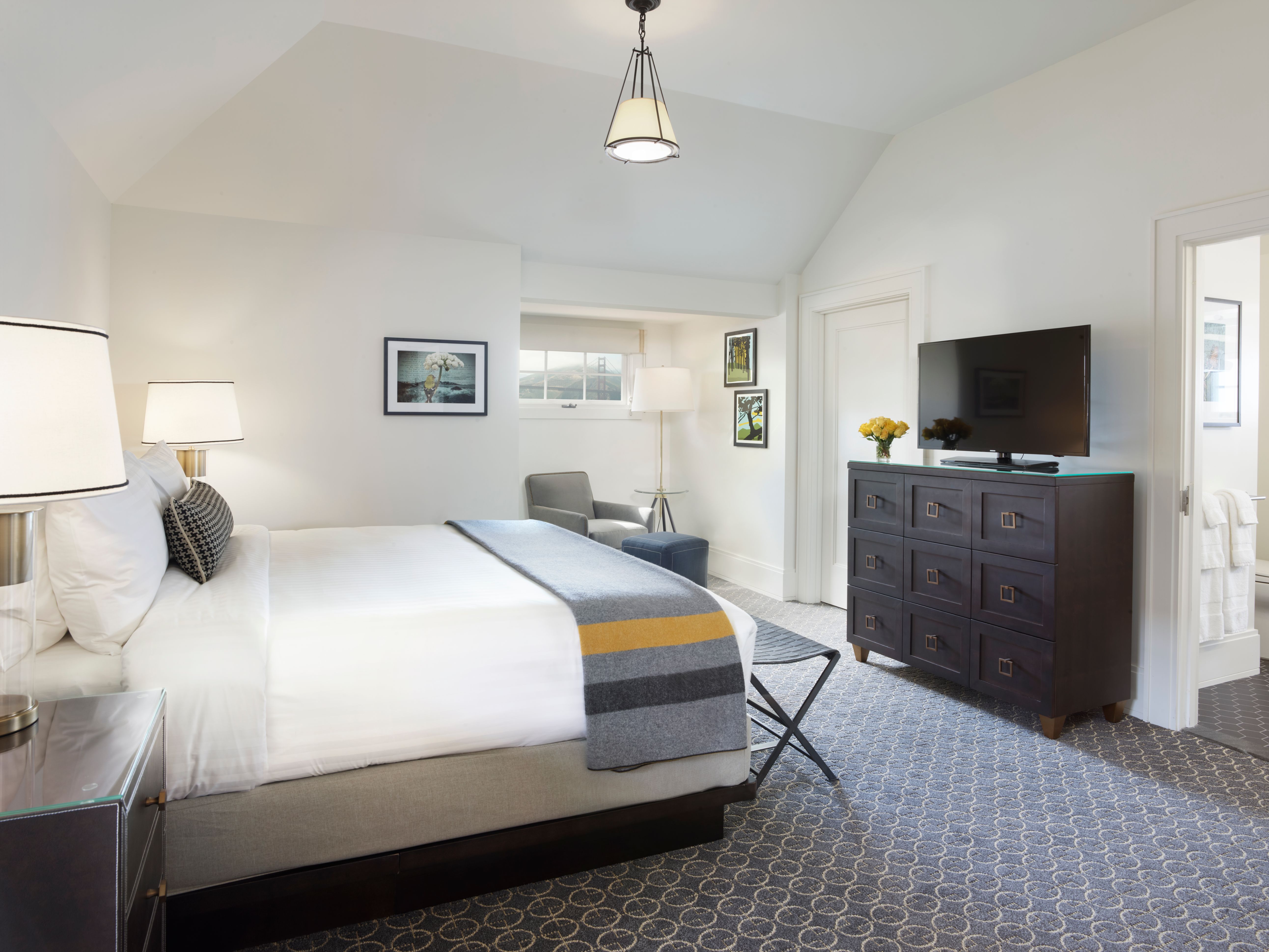 a bedroom with a bed and a dresser