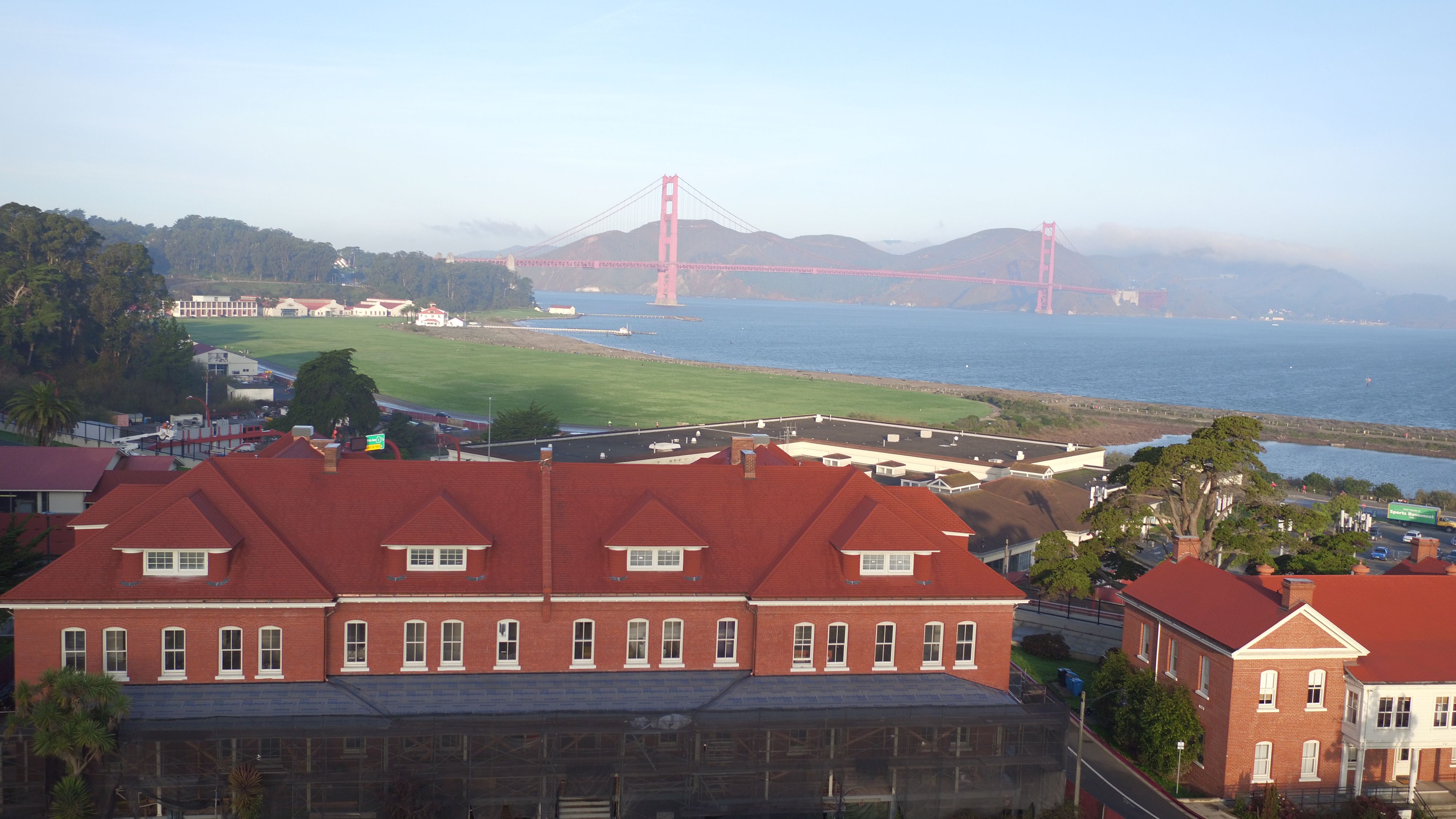 a large building with a bridge in the background