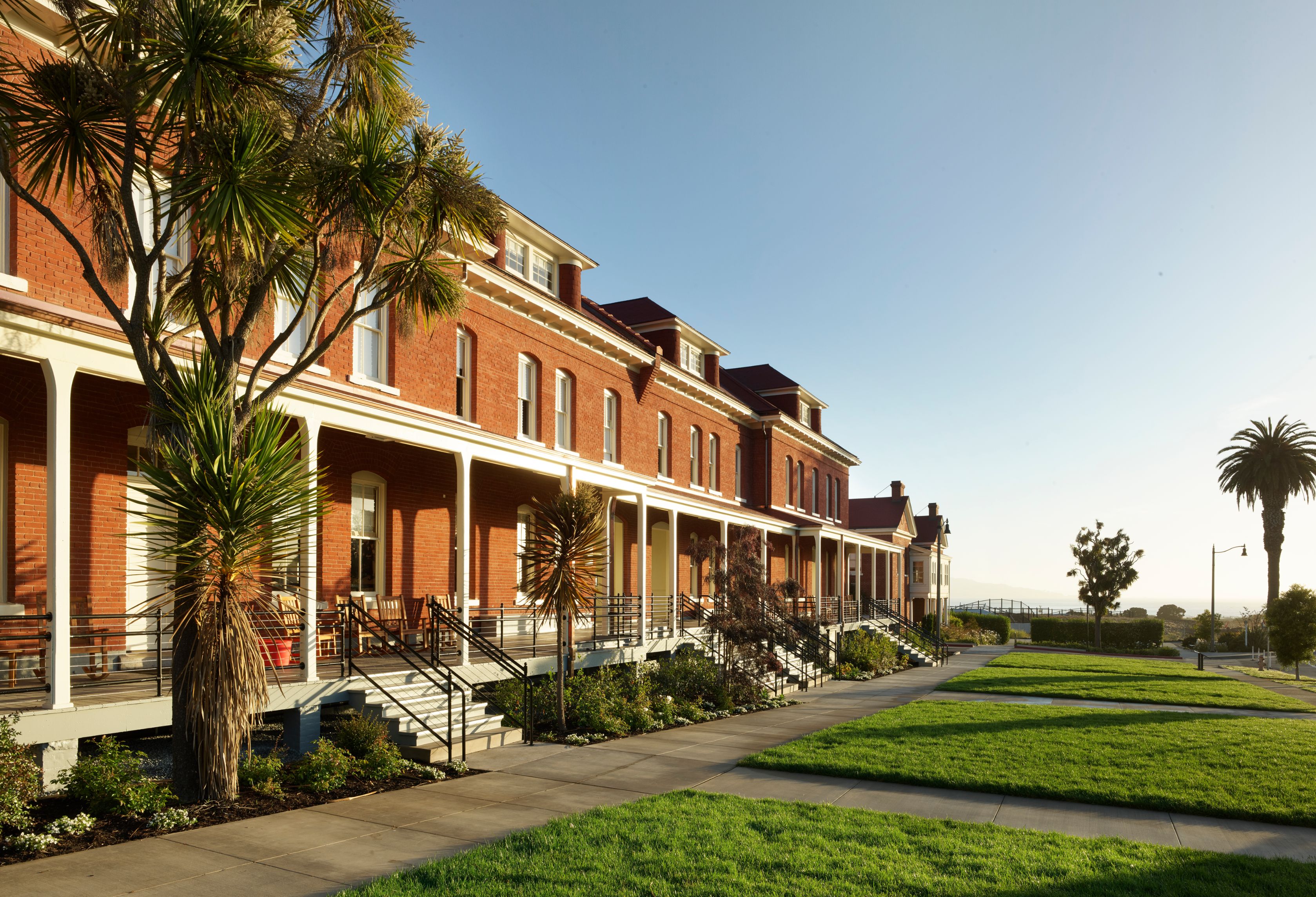 a building with a lawn and grass