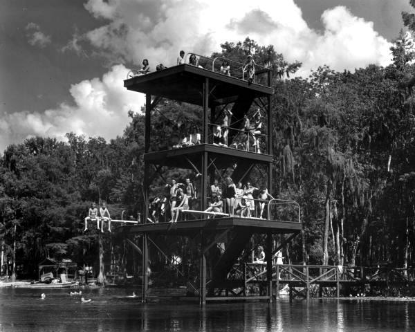 a group of people sitting on a platform