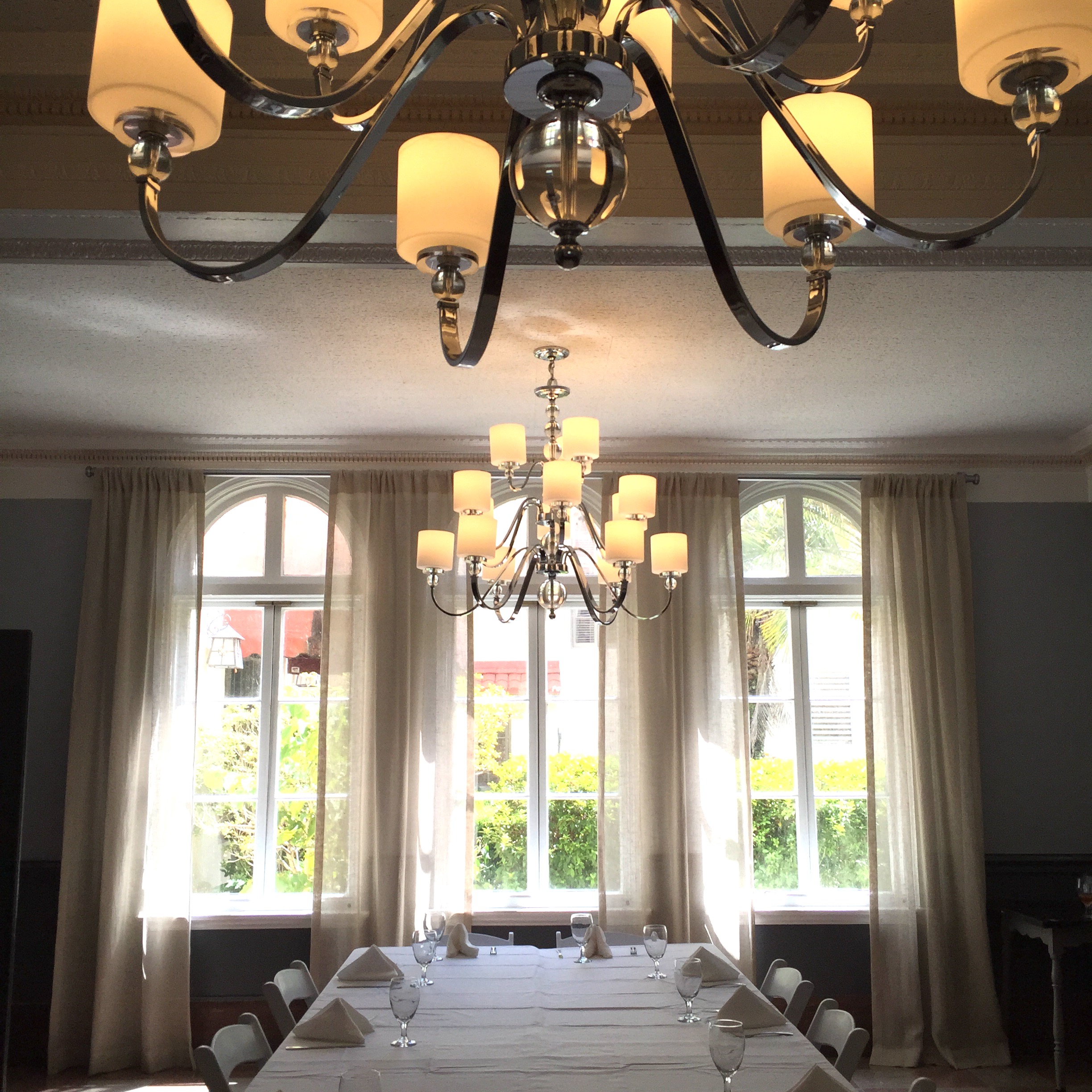 a chandelier over a table