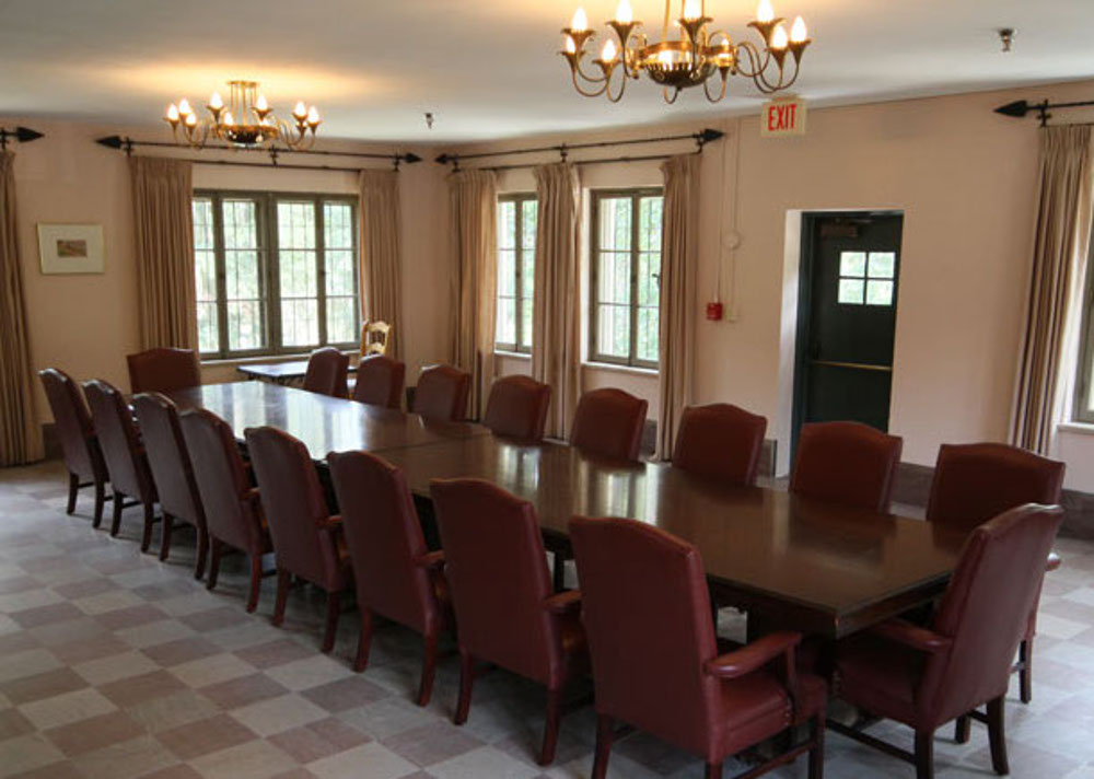 a long table with chairs in a room