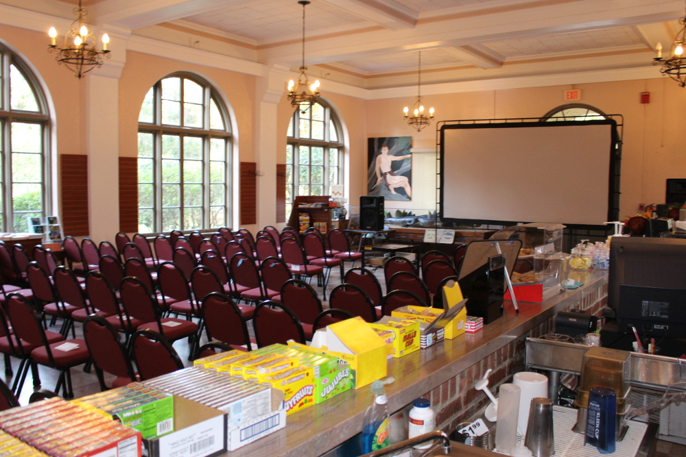 a room with a large table and chairs