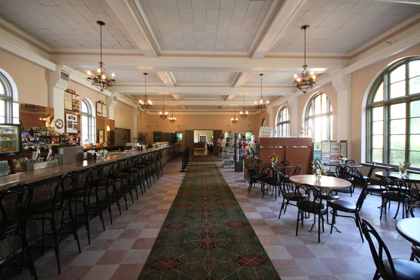 a long room with tables and chairs