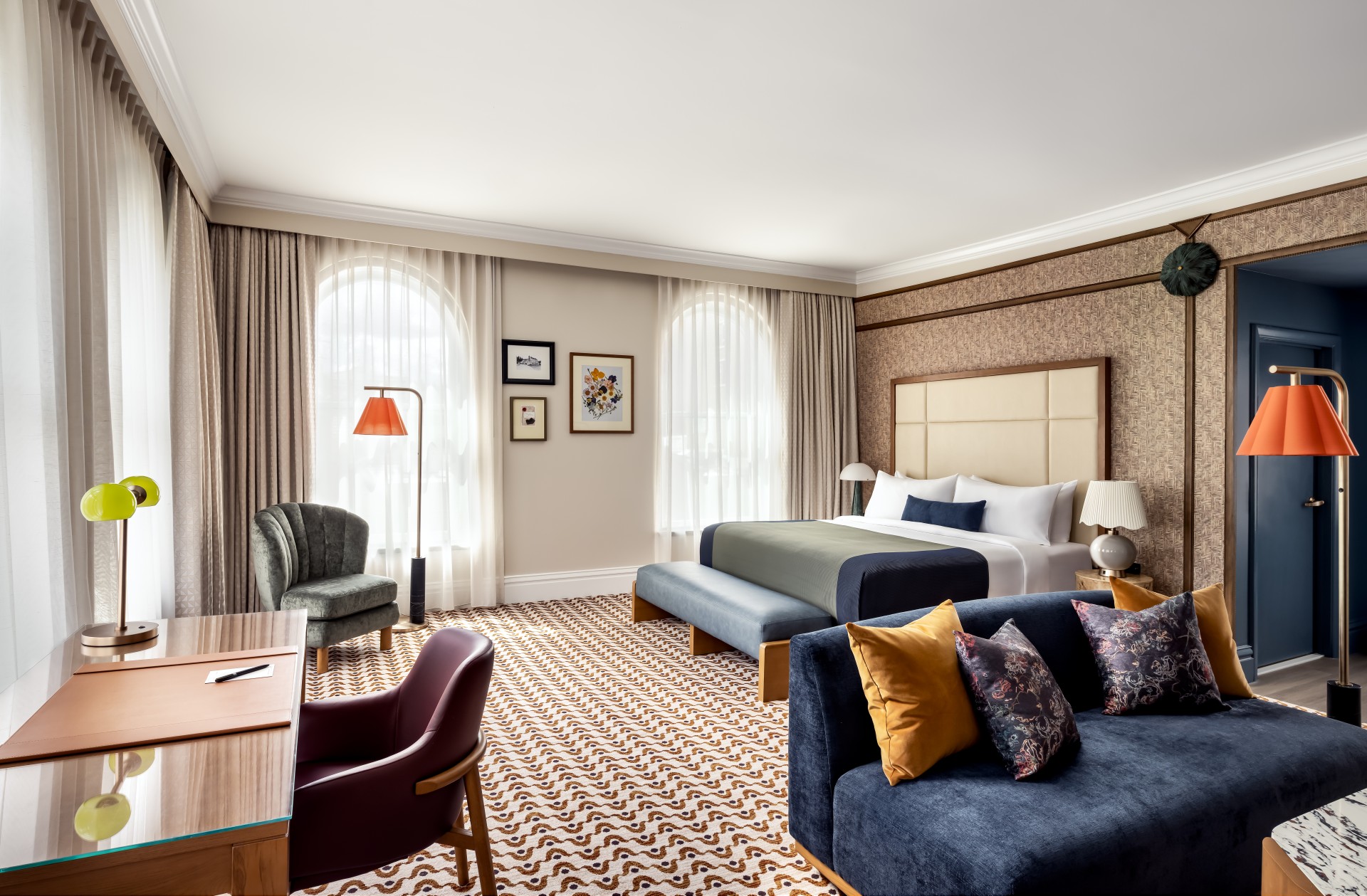 a room with a bed and a desk