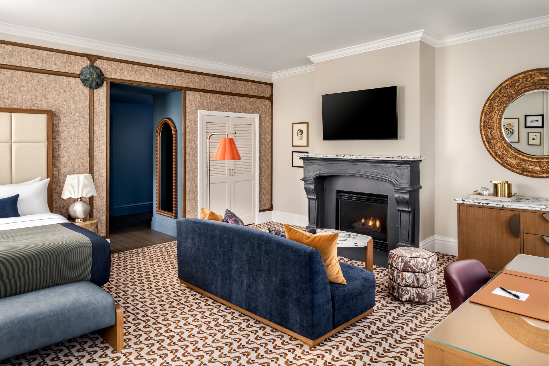 a living room with a fireplace and couches