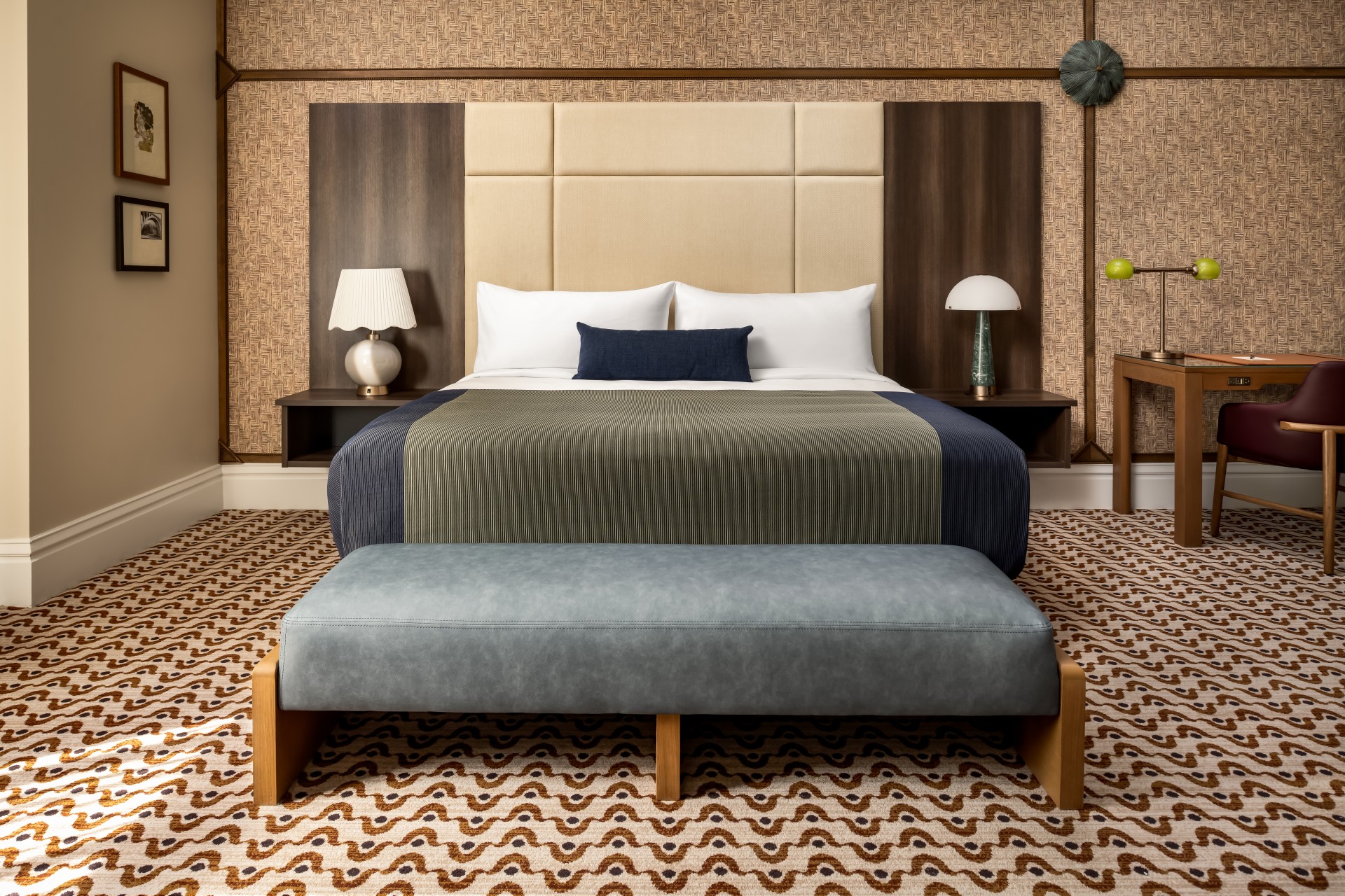a bed with a bench in a room